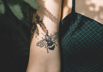 Bee tattoo on wrist