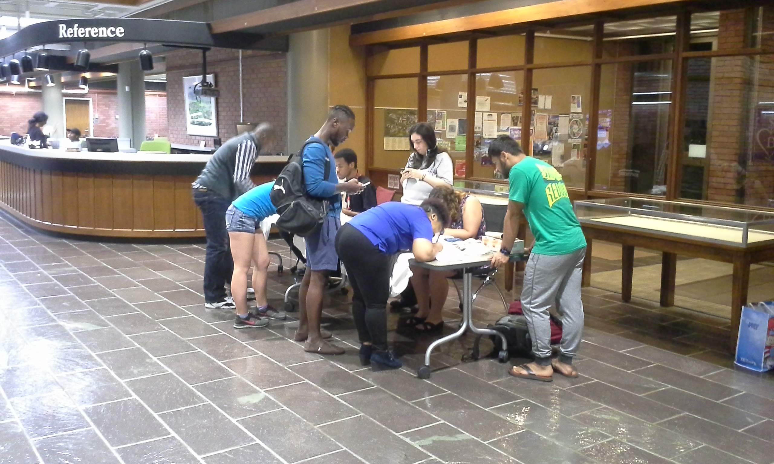Students at table for Clothesline Project at Hutchins Library