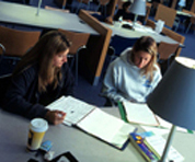 Photo of two students studying in the King Library