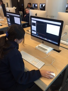 Students working on computer coding projects