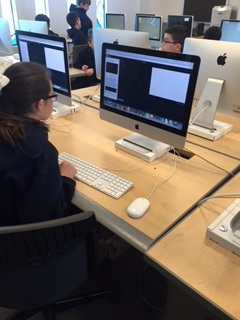 Students working on computer coding projects