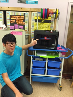 Student with 3D printer in use