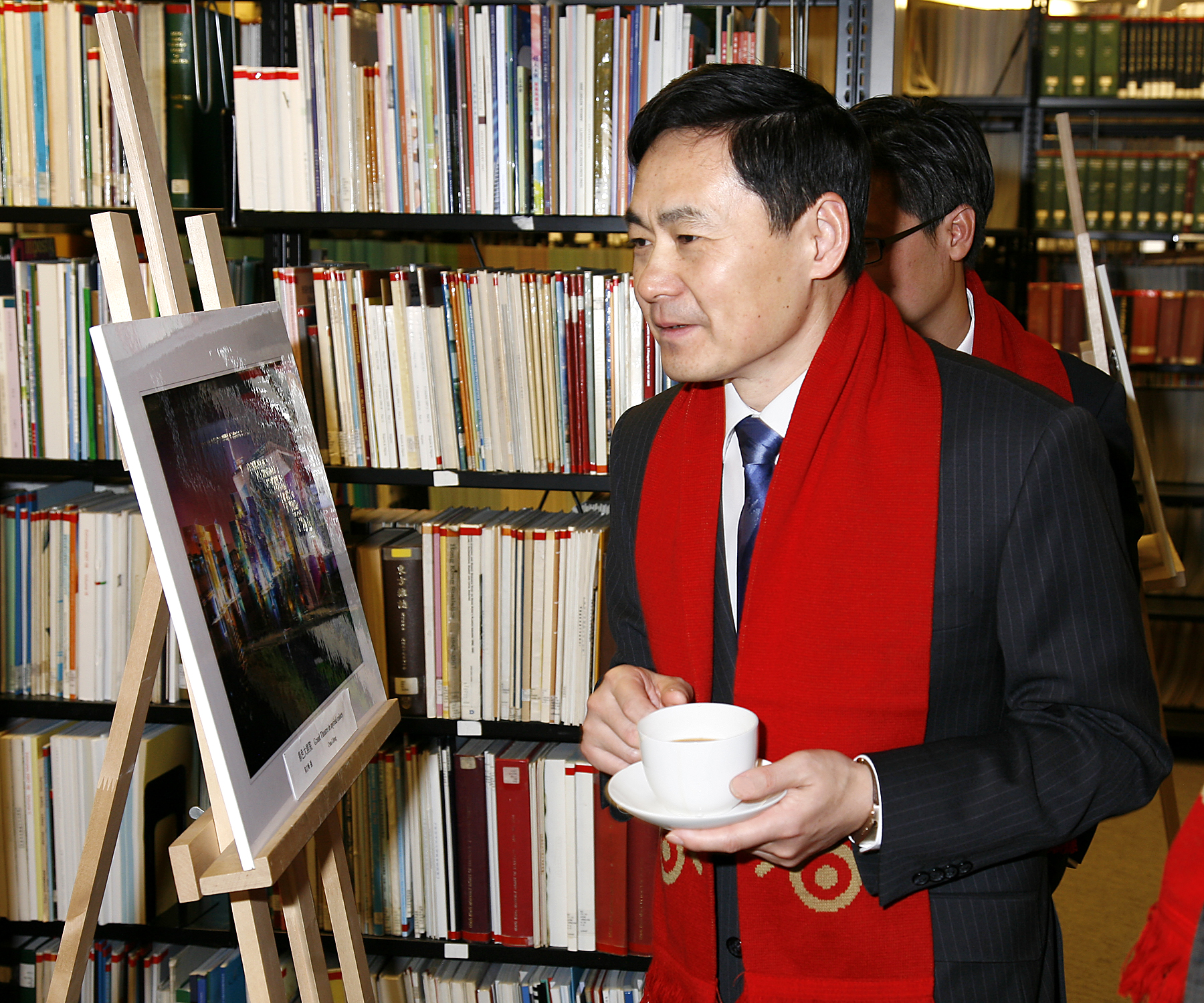 One special attendee immersed in the photos on exhibit