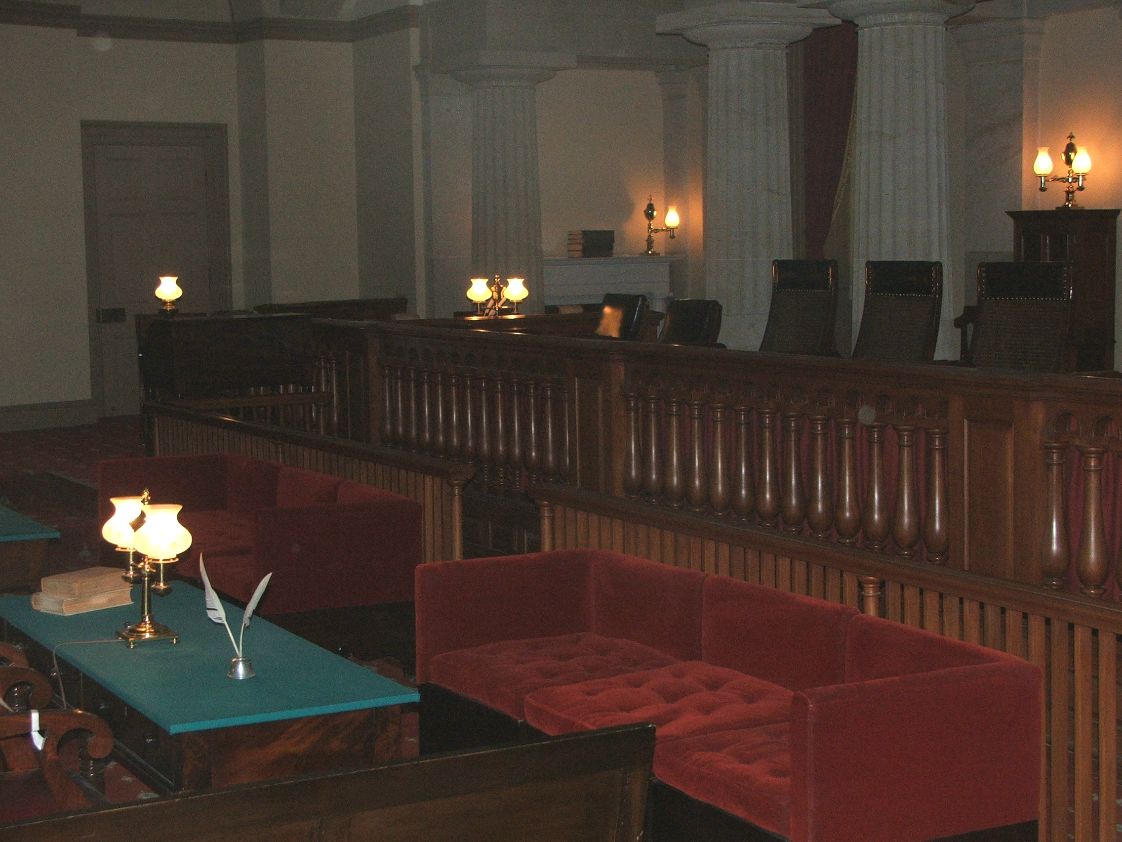 Quill pens and old-fashioned lanterns lend a historical air to the old Supreme Court Chamber.