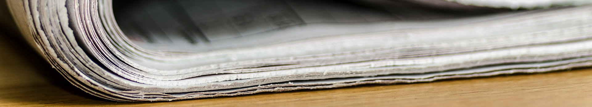 Photograph of the edge of a folded newspaper