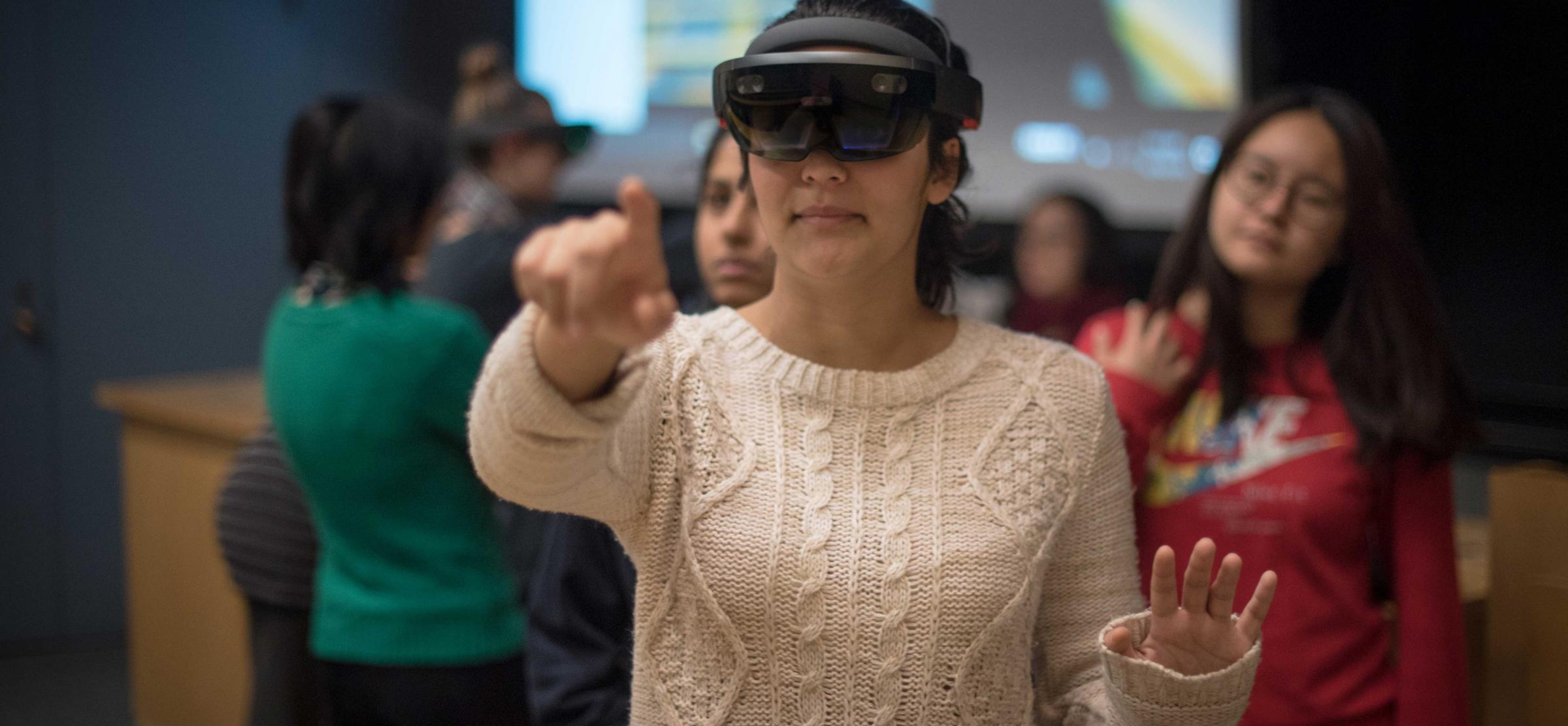 Student wears HoloLens headset.