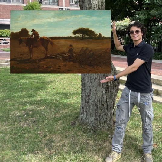In this photomontage, a smiling young man stands next to a tree, gesturing toward a landscape painting that appears to float. In the foreground of the painting, two boys and a horse clear a large brown field. 