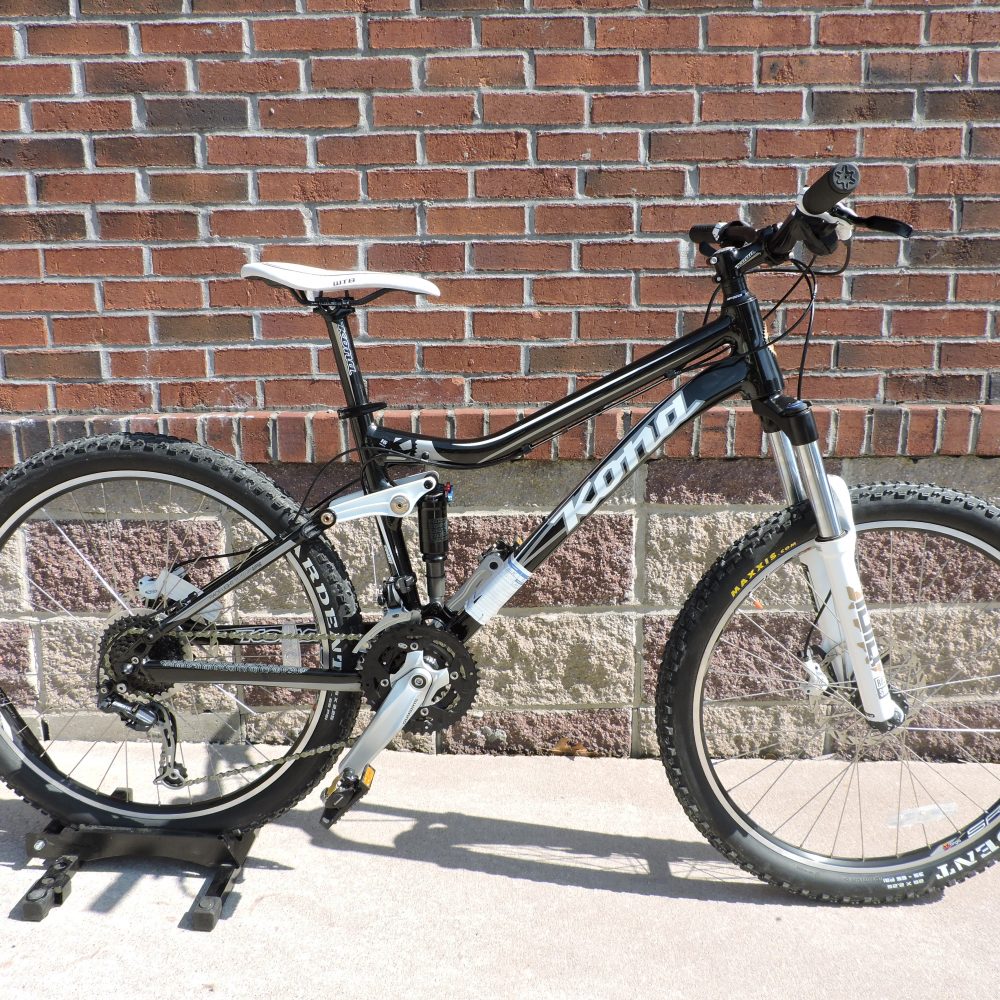 Black bike with white Kona logo