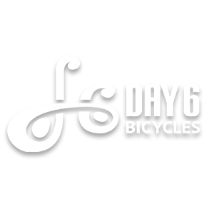 Day 6 Bicycles brand logo in white