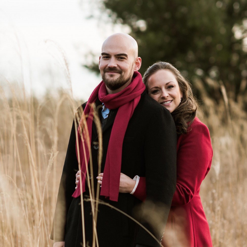Lisa Castellani and Kyle Phillips Embracing in Field
