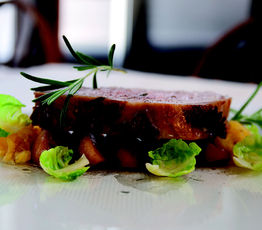 Whole Roast Loin of Pork with Caramelized Apples, Spaghetti Squash and Brussels Sprout Petals