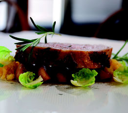 Whole Roast Loin of Pork with Caramelized Apples, Spaghetti Squash and Brussels Sprout Petals