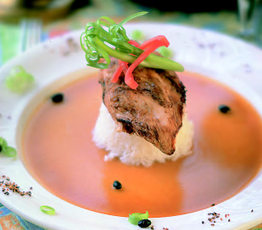 Peanut-Crusted Chicken Breast Surrounded by a Thai Red Curry Broth