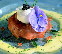 French Blini with Smoked Sturgeon Poached Eggs and Chive Hollandaise Sauce