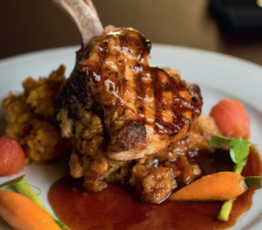 Apple Sausage Cornbread-Stuffed Double Pork Chops with Apple Cider Reduction