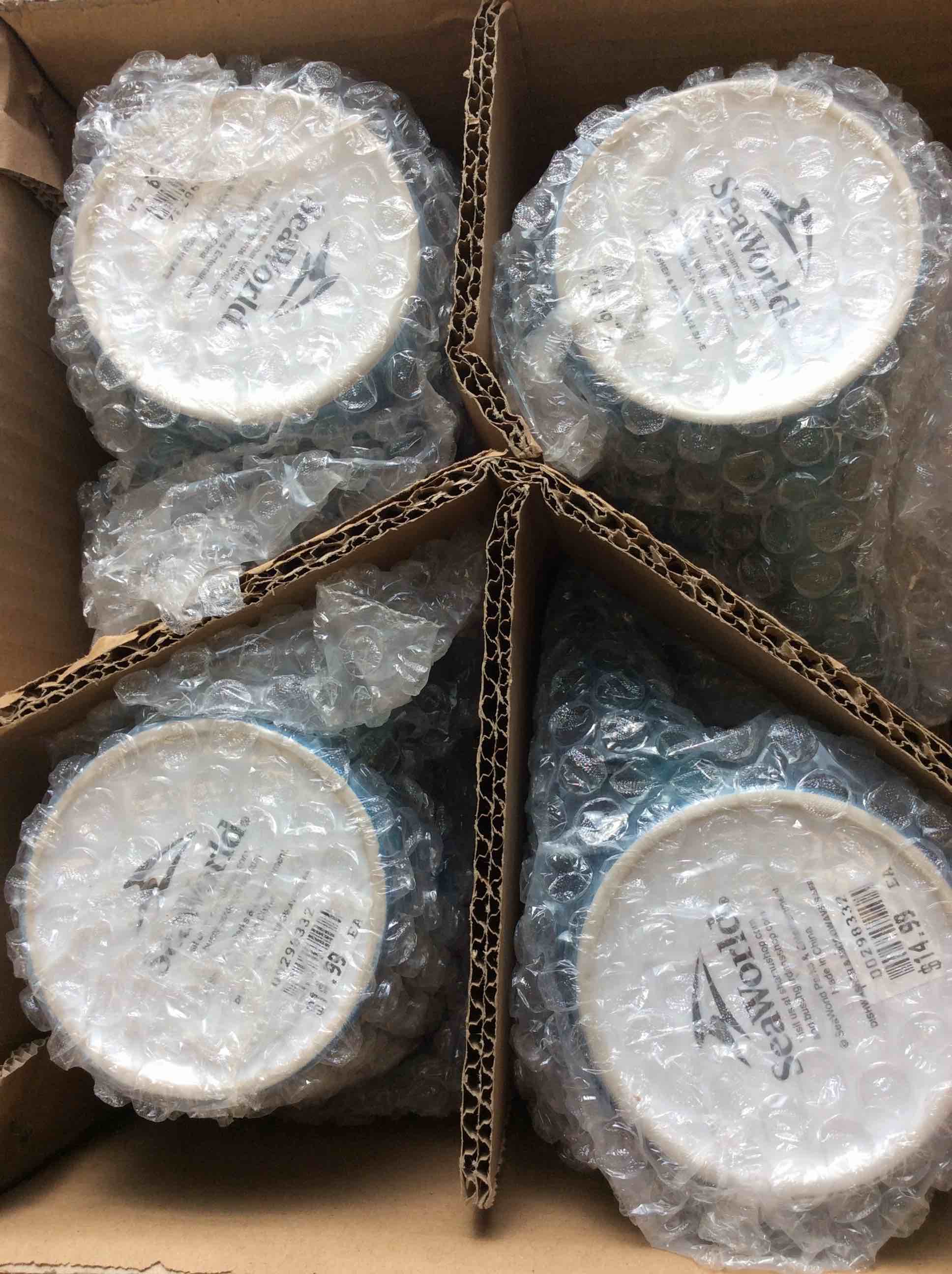 Condition photo showing New/Like New for box of 4 seaworld blue dolphin mugs