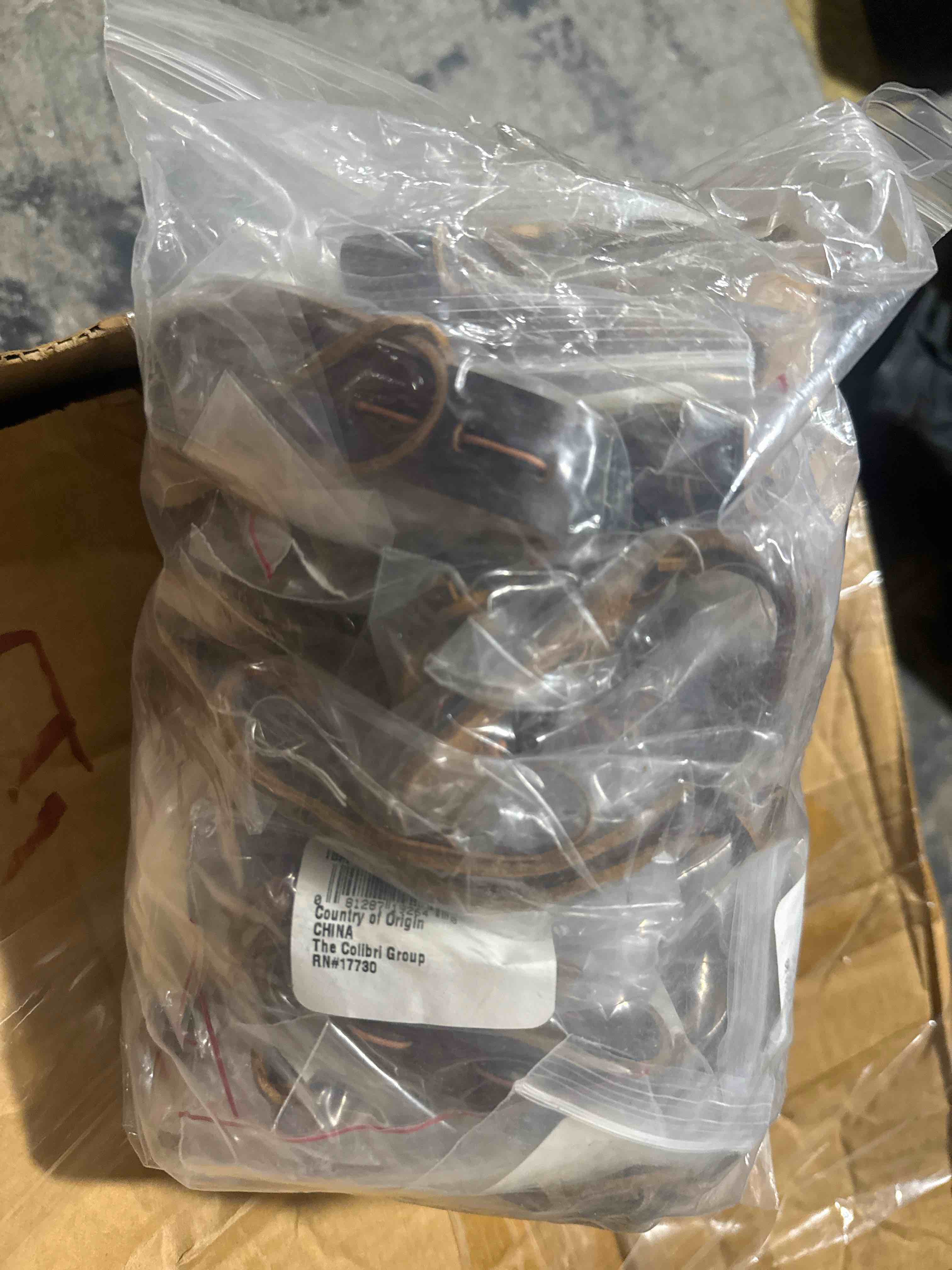 Condition photo showing Brand New for (case of 50) distressed brown leather, hand-laced detailing, and adjustable fit, this bracelet adds the perfect touch of rugged western charm to any outfit.