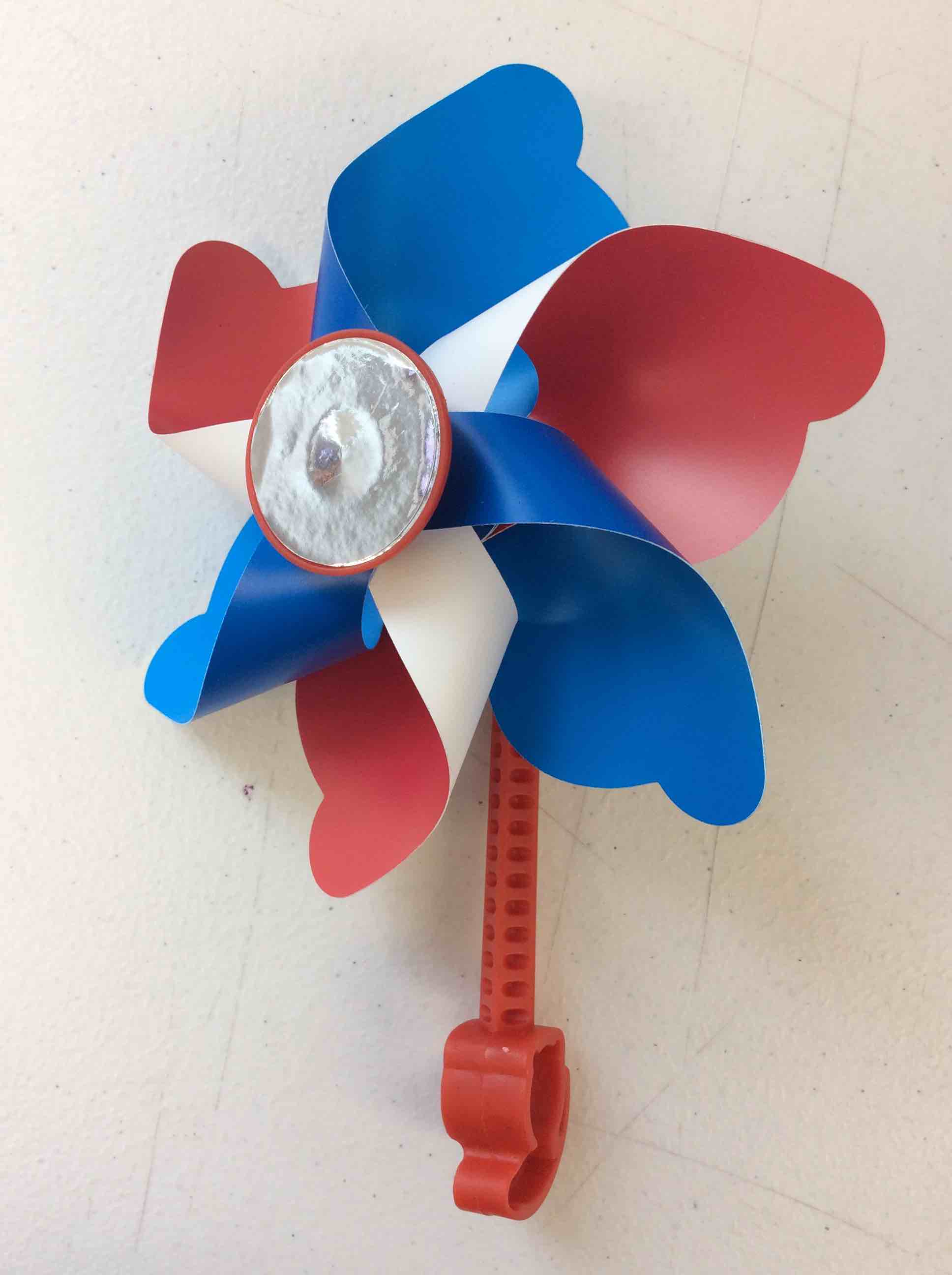 Condition photo showing New/Like New for fun express patriotic clip-on bike pinwheel