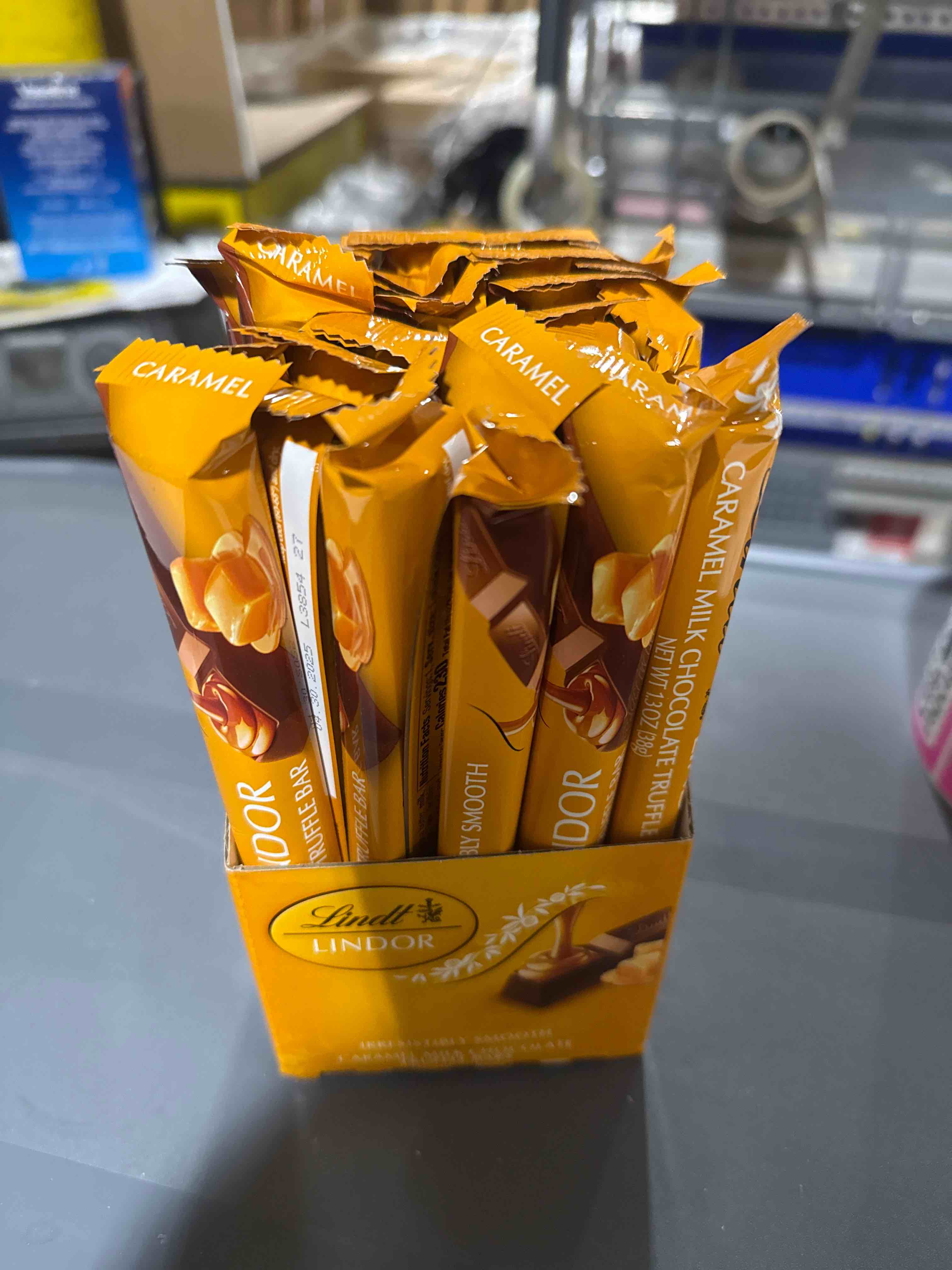 Condition photo showing Brand New for 24 pack lindt lindor caramel milk, chocolate truffle bar 