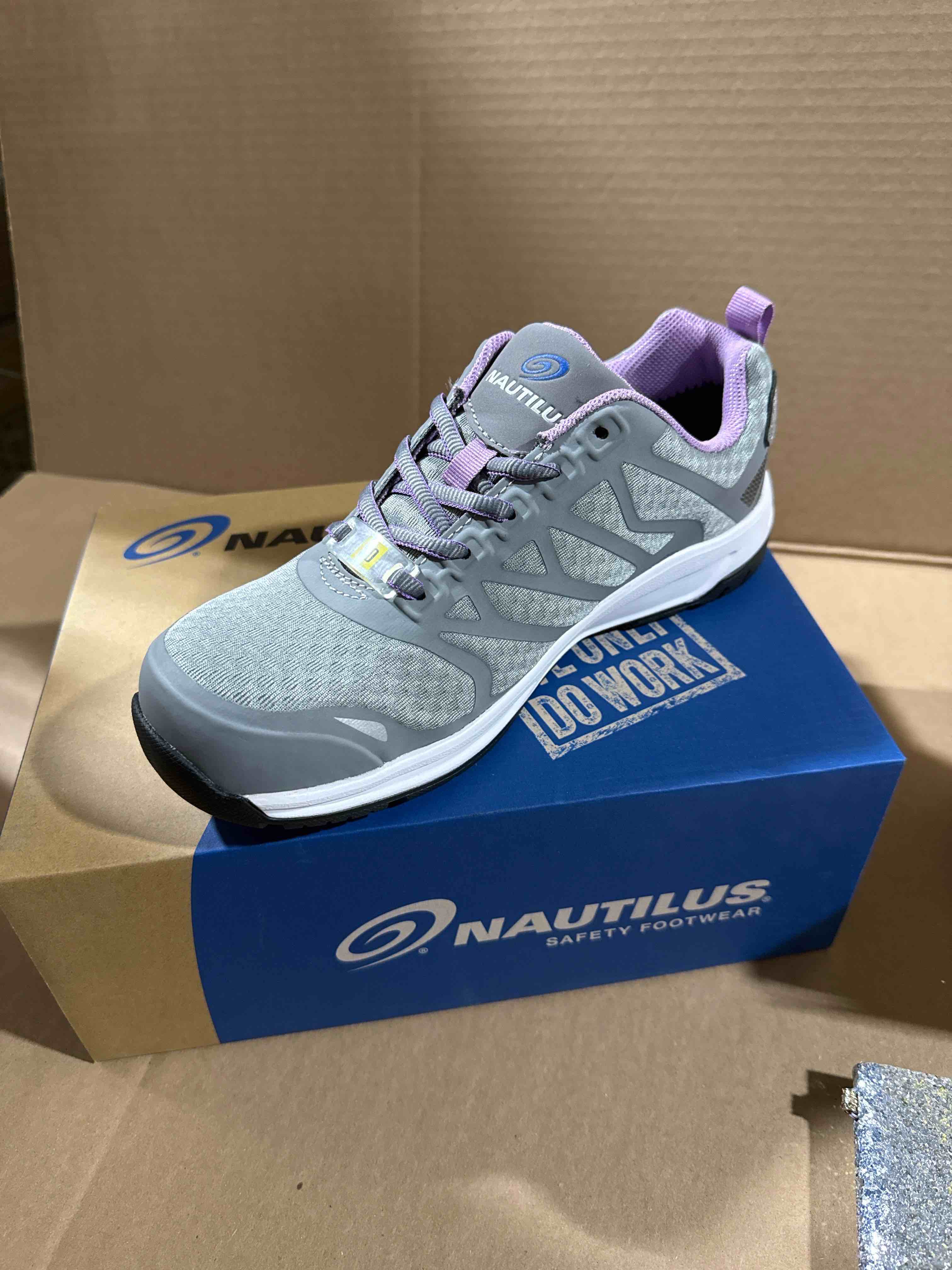 Condition photo showing Brand New for size 7 women’s Nautilus safety shoes, carbon fiber, safety to slip and oil resistant safety footwear