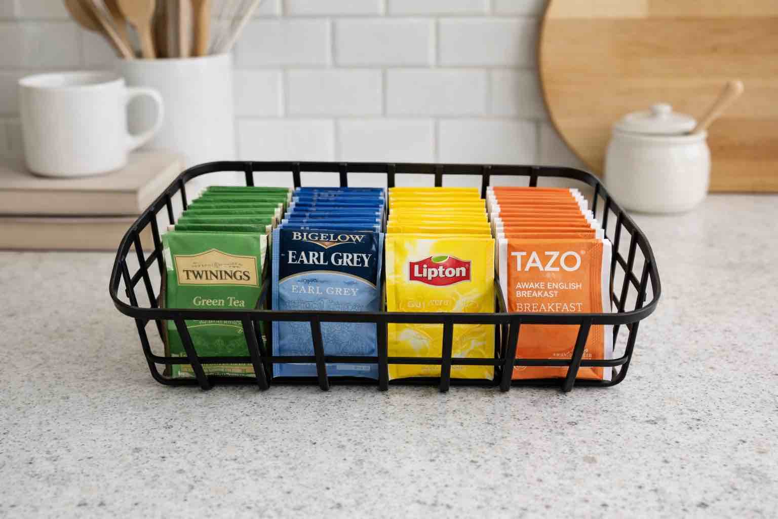Tea bag organizer with multiple compartments to neatly sort and display your favorite teas on the countertop or in a cabinet.