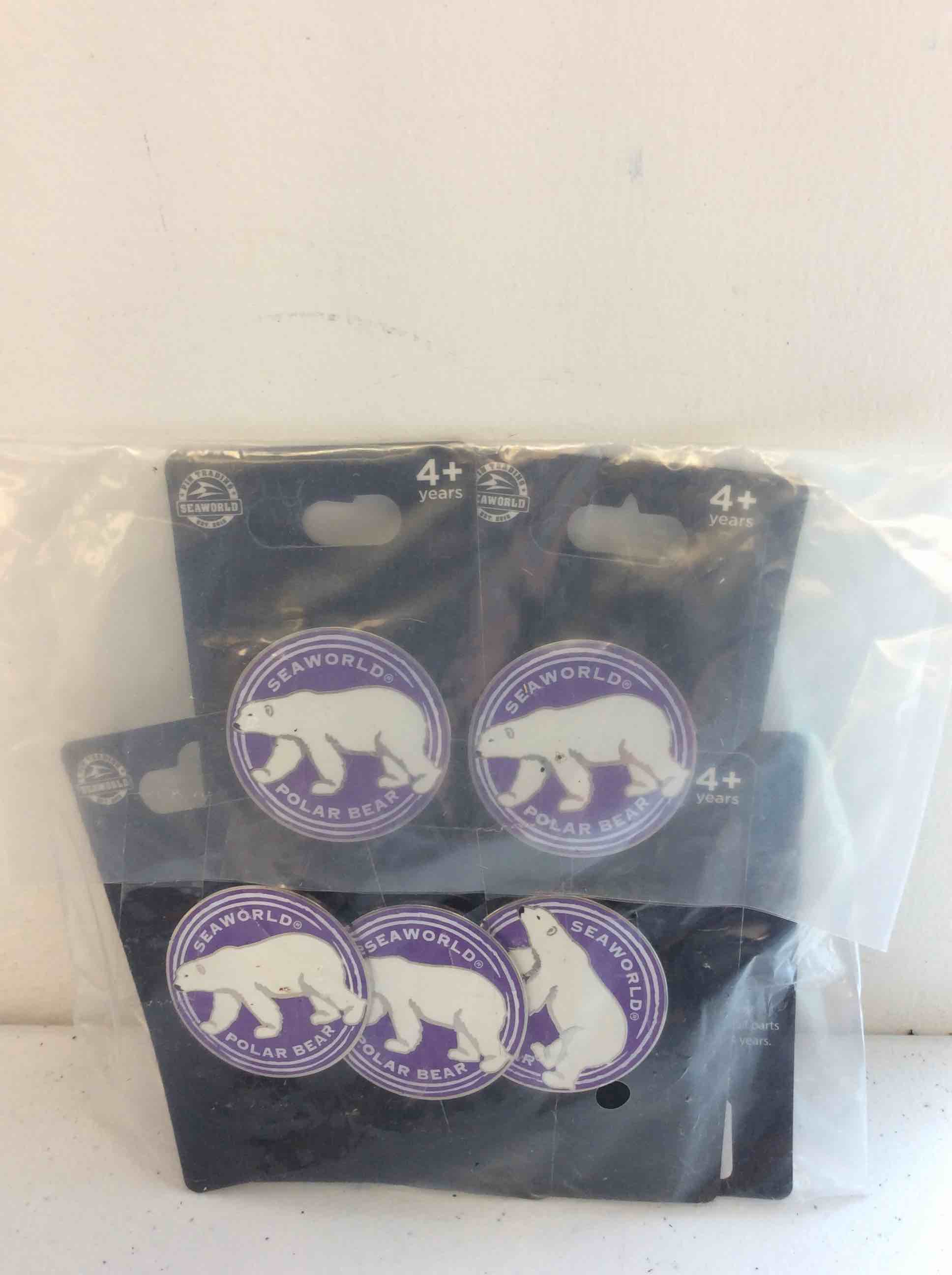 Condition photo showing New/Like New for sea world pin trading polar bear pins 10 pcs