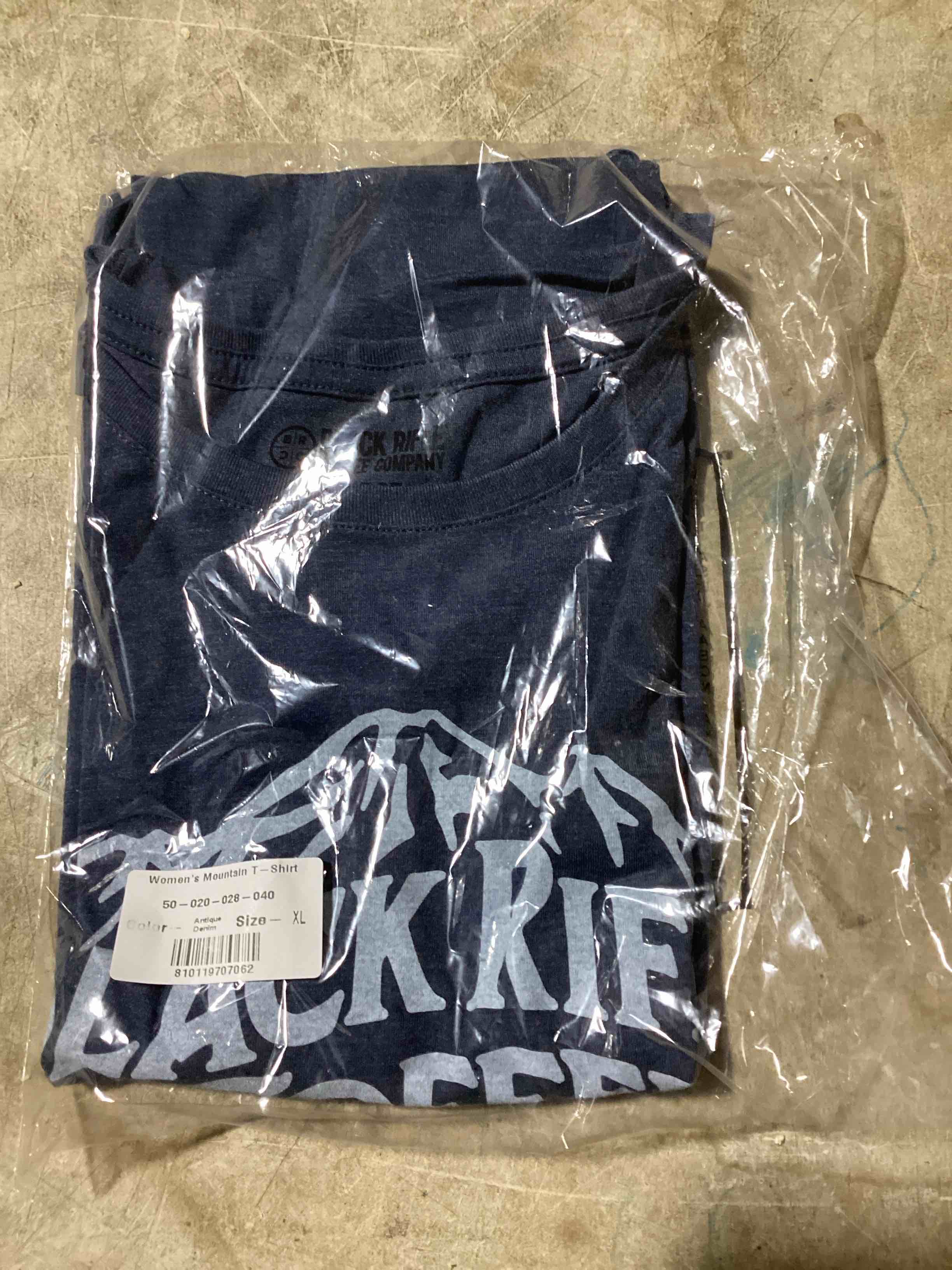 Condition photo showing New/Like New for size medium woman’s black rifle coffee company antique denim mountain t-shirt