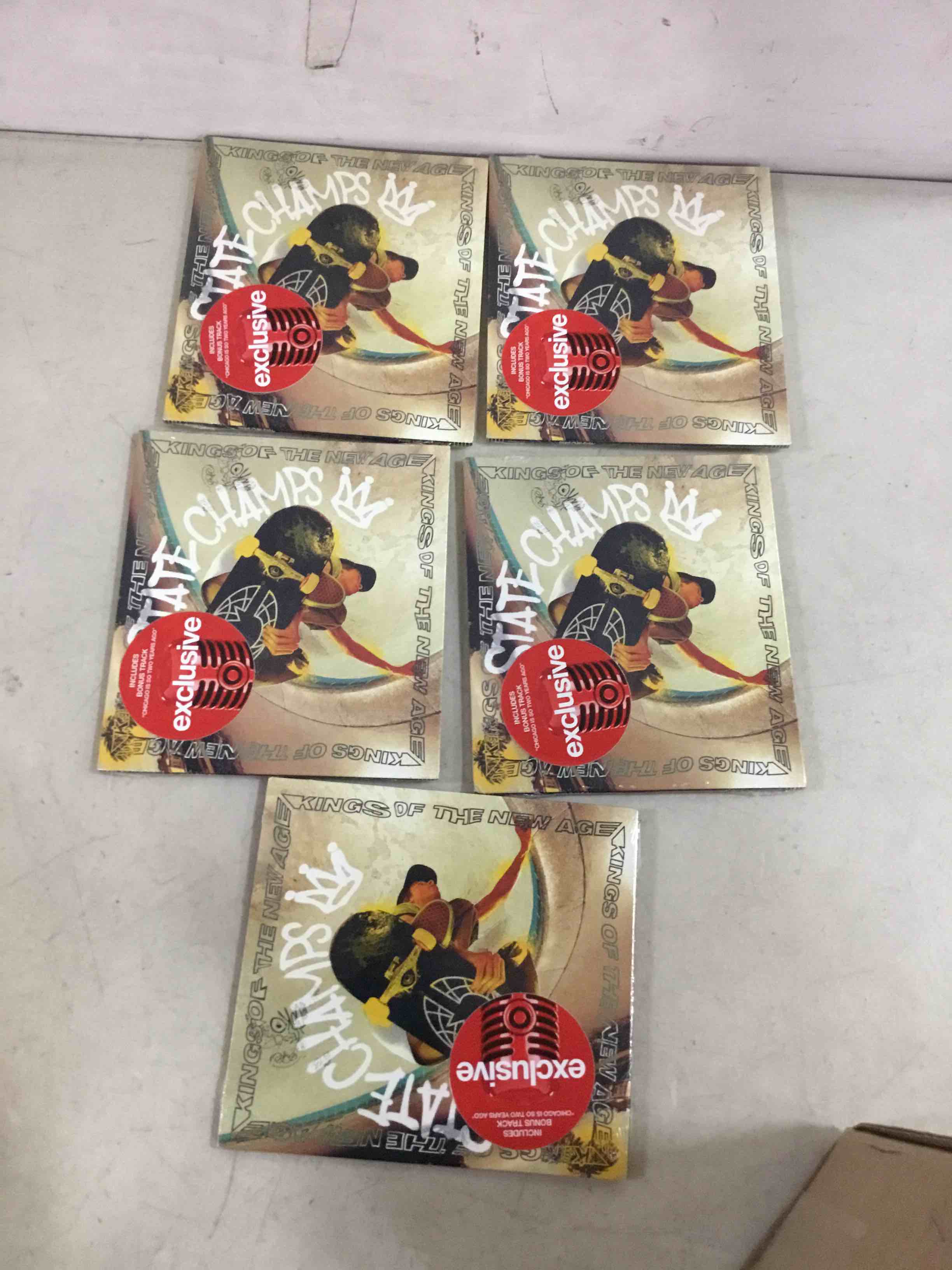 Condition photo showing New/Like New for STATE CHAMPS - KINGS OF THE NEW AGE *BONUS TRACK*