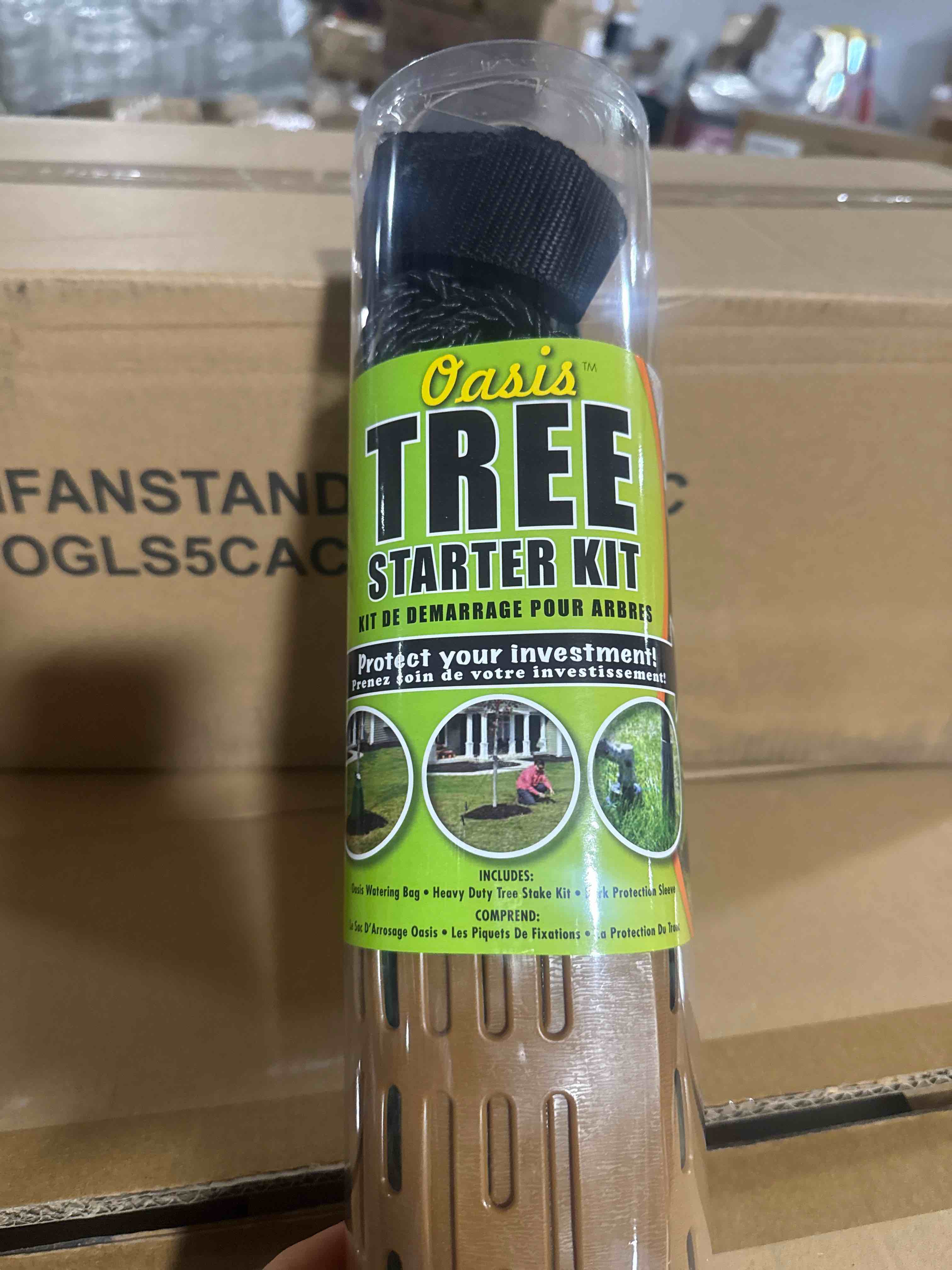 Condition photo showing Brand New for oasis tree starter kit w/20 gallon watering bag, stake kits and bark protector.