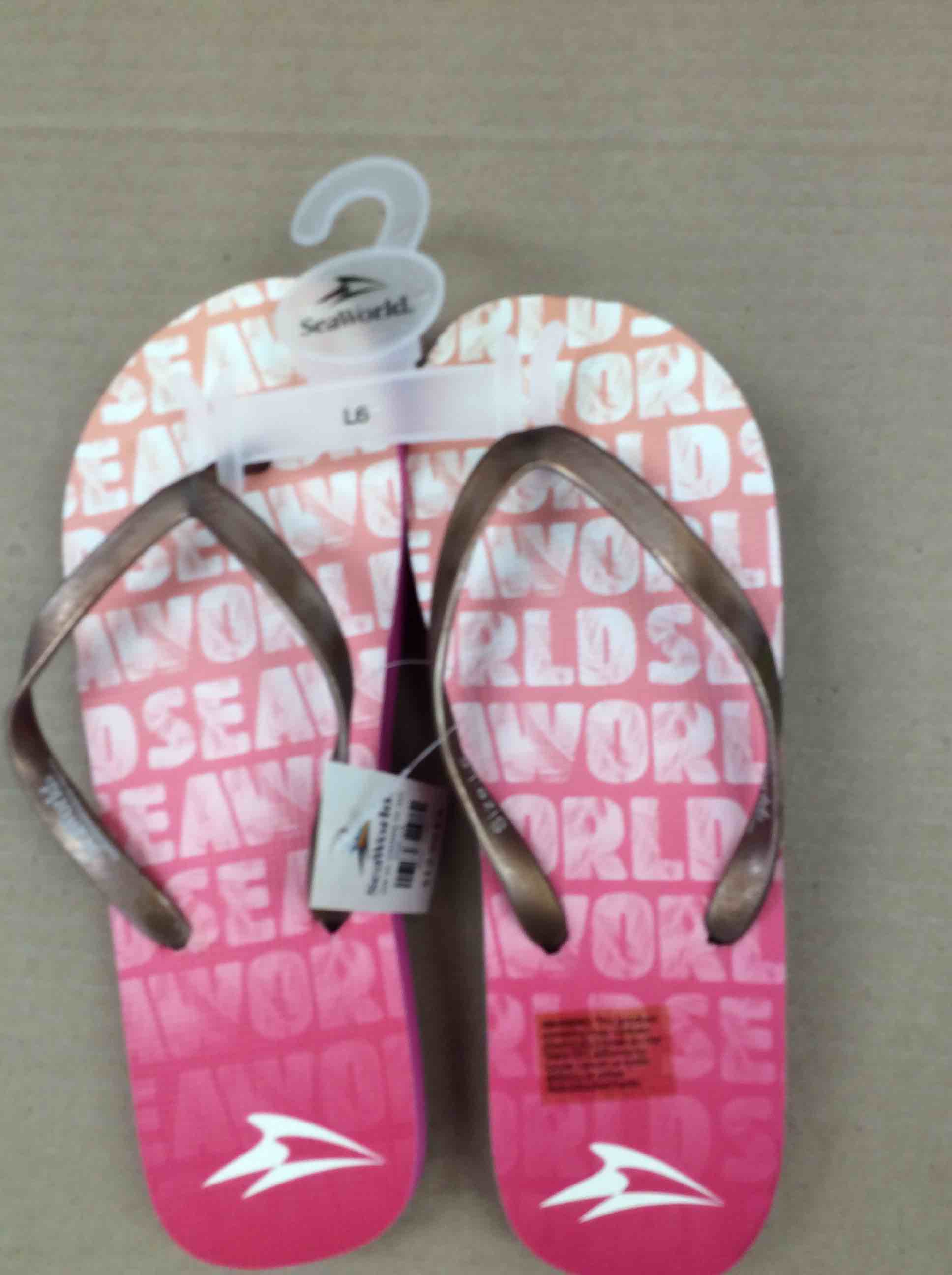 Condition photo showing New/Like New for seaworld vl ombré ff ad pink sandals