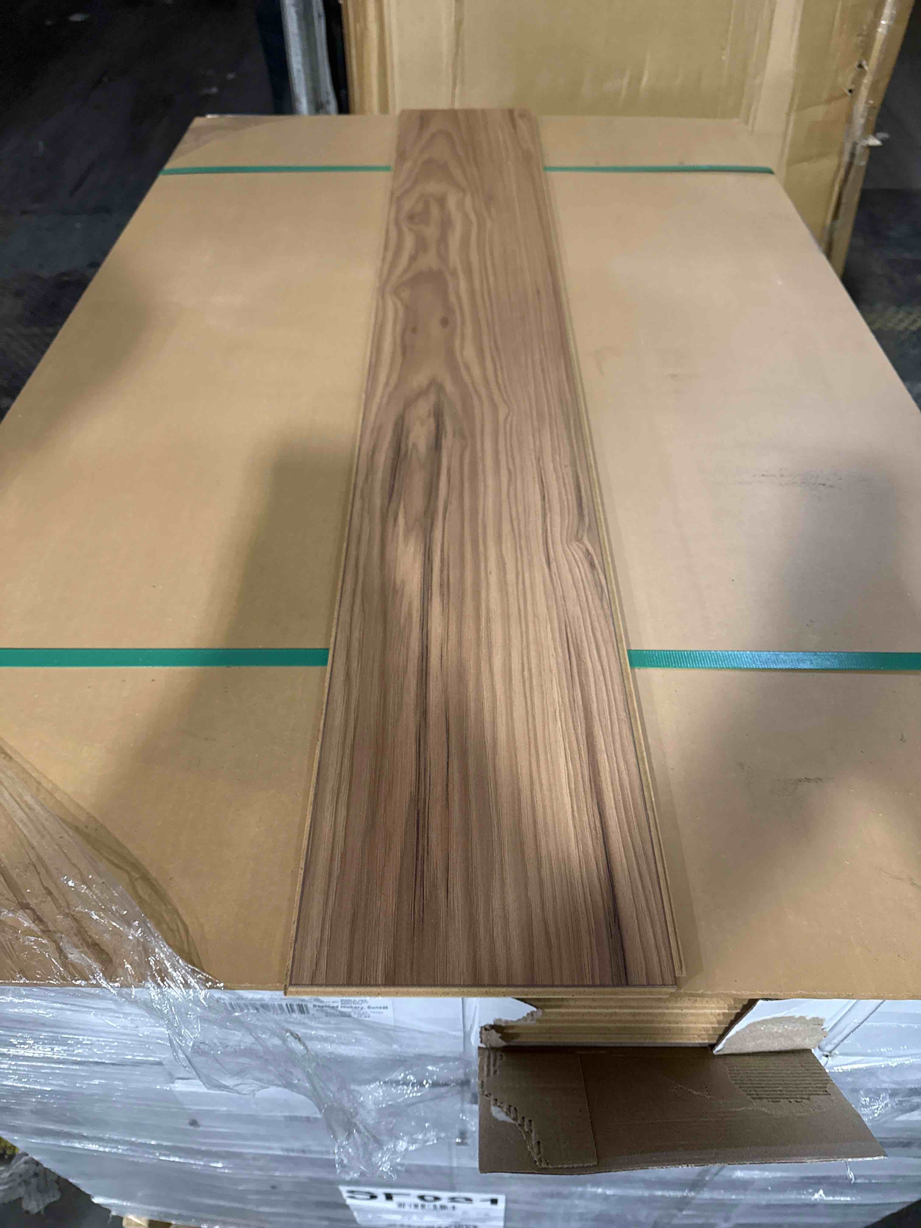 Condition photo showing Good Condition for Beached Hickory Sunset Laminae Flooring with Attached Pad 10 mm 50.67” x 7.78” (23.69 sq ft/ box) 32 boxes 758.08 total sq ft 