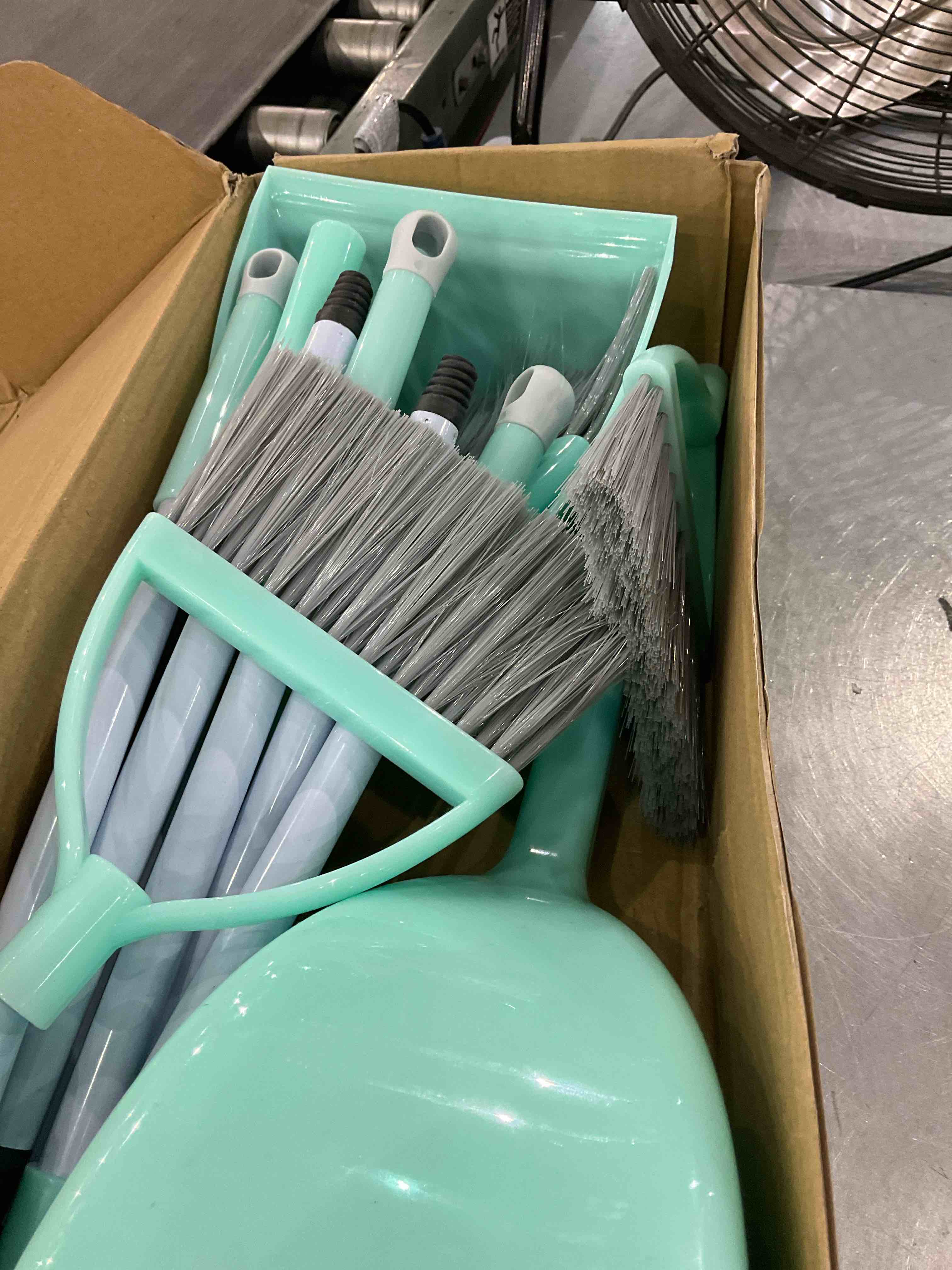 set of brooms and dust pans 