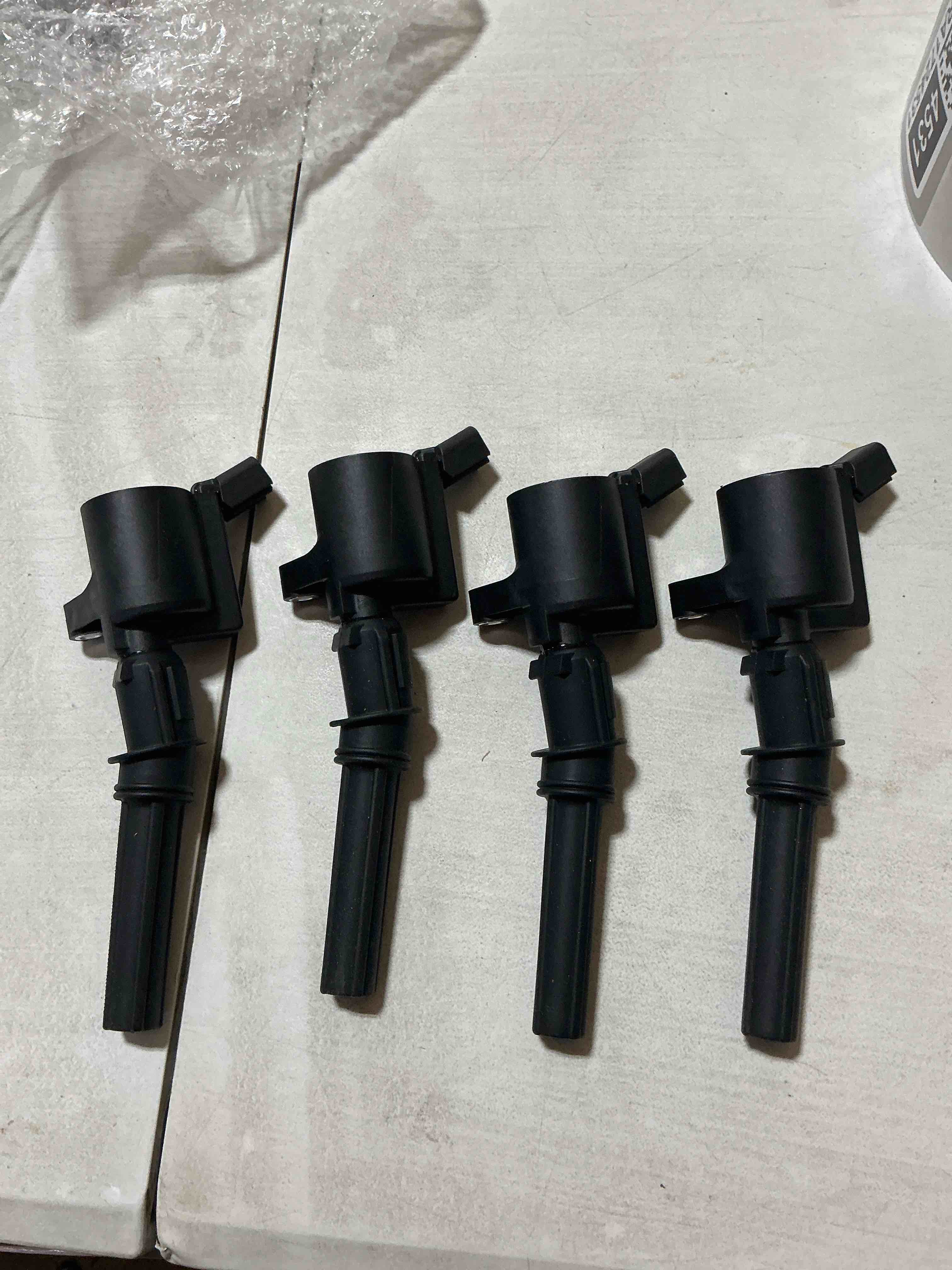 Condition photo showing New/Like New for set of 4 ignition coil pack compatible with v8 5.4l 4.6l ford expedition f150 f250 f350 explorer excursion e150 e250 e350 crown victoria mustang lincoln replace dg508 fd503 sp479