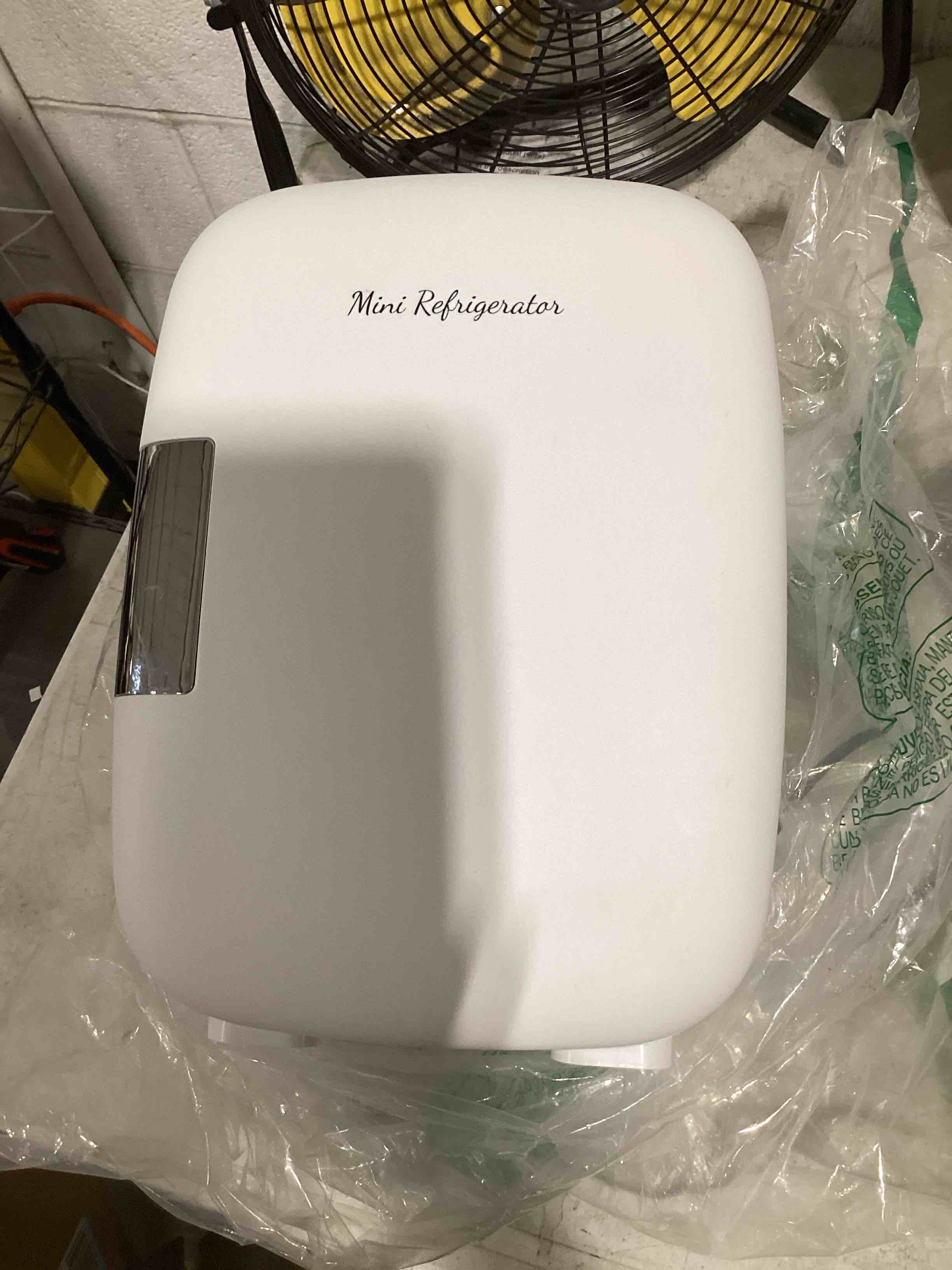 Condition photo showing As Is for dumos mini fridge for bedroom, 4l compact personal fridge cooler for skincare, drinks, and snacks, fits 6 cans, mini refrigerator with 110v ac/12v dc, ideal for car, dorm, white white 4 liter