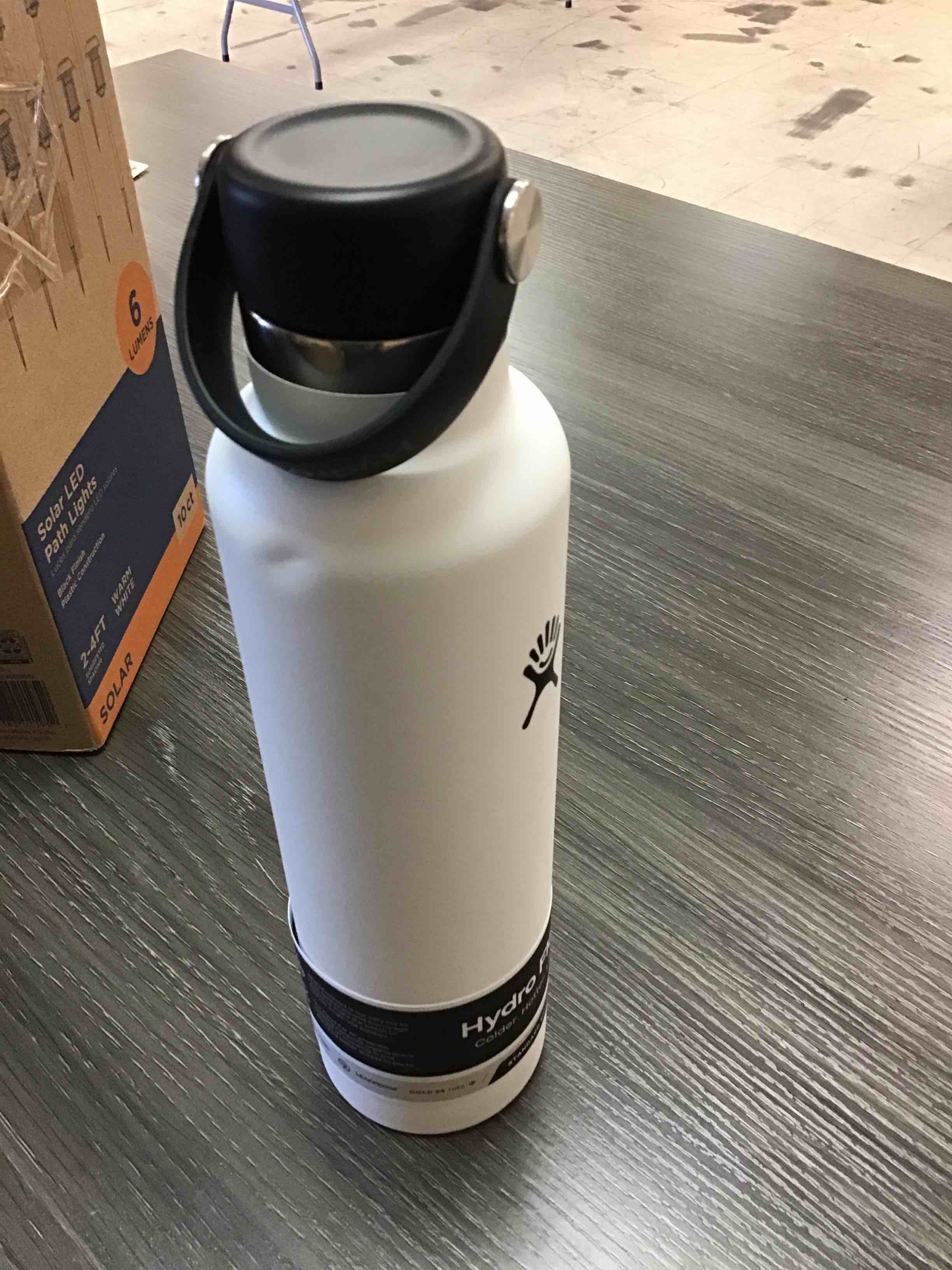 Condition photo showing Good Condition for hydro flask water bottle - insulated stainless steel - non spill, leakproof in 24 oz white, (dented area, see photo)