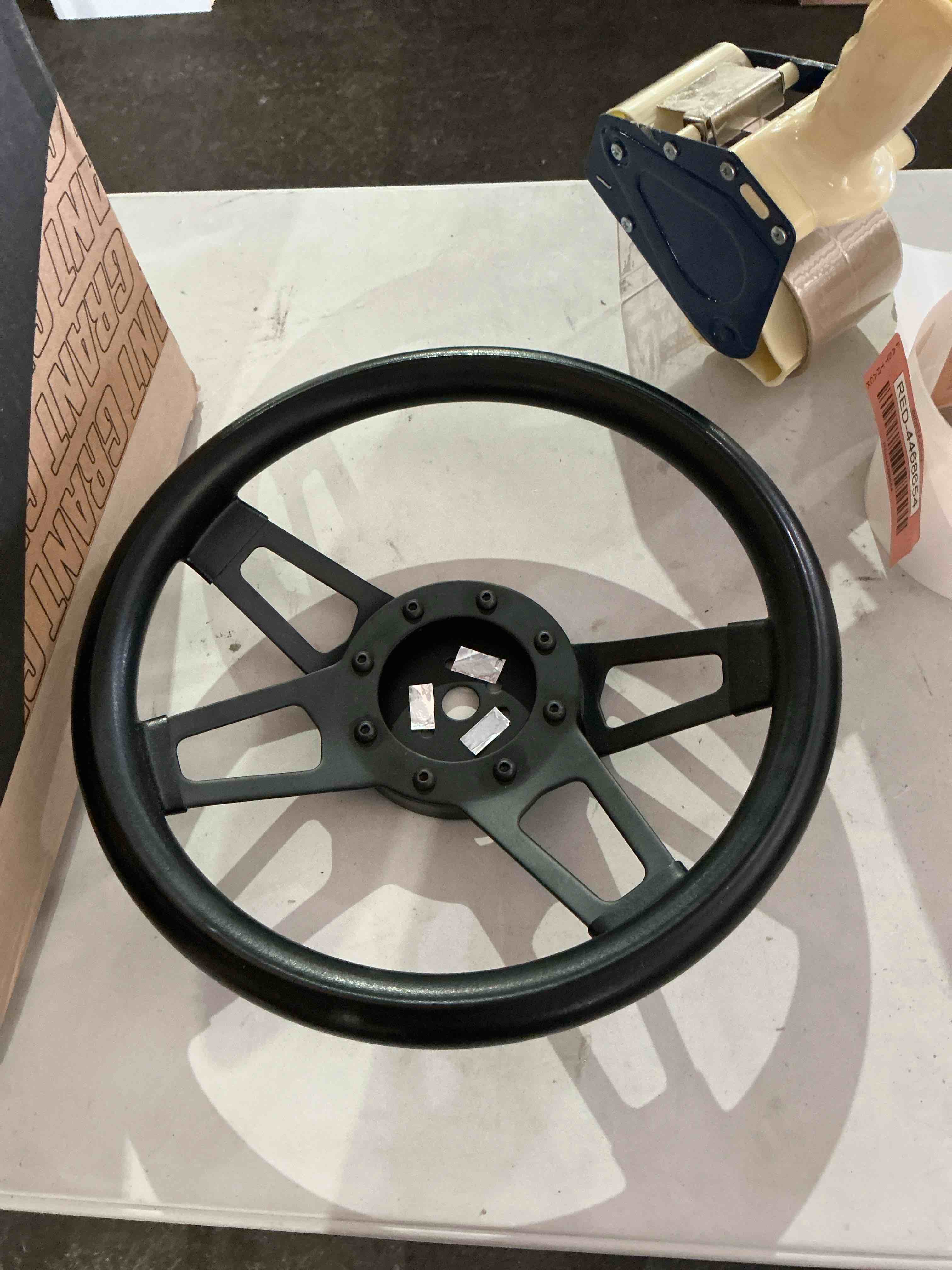 Condition photo showing New/Like New for grant® 414 - 4-spoke challenger style black cushioned foam steering wheel
