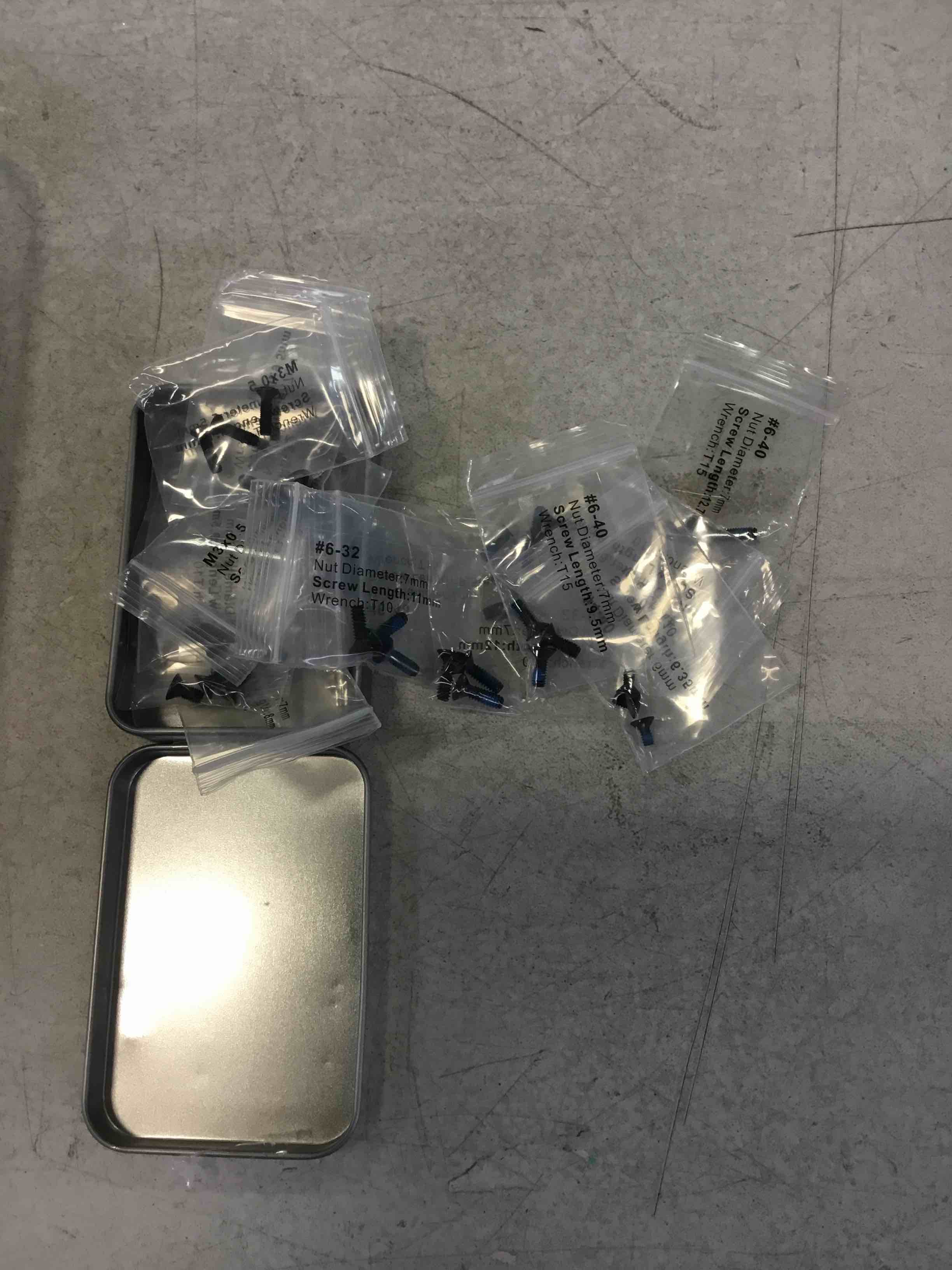 small tin of tiny screws