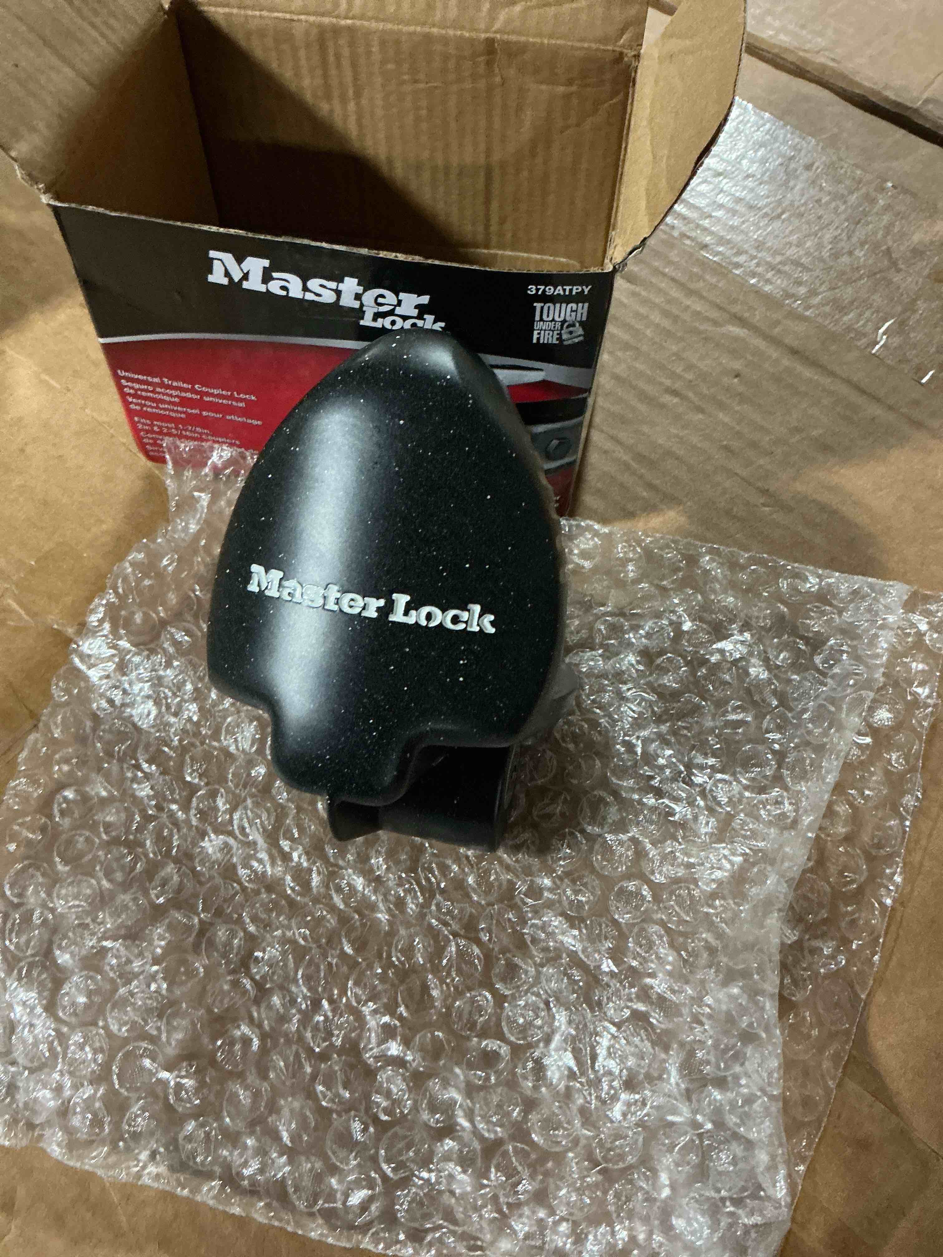 Condition photo showing As Is for master lock black universal size trailer hitch lock, trailer coupler lock for securing rv’s, horse trailers, tool trailers and more, 379atpy