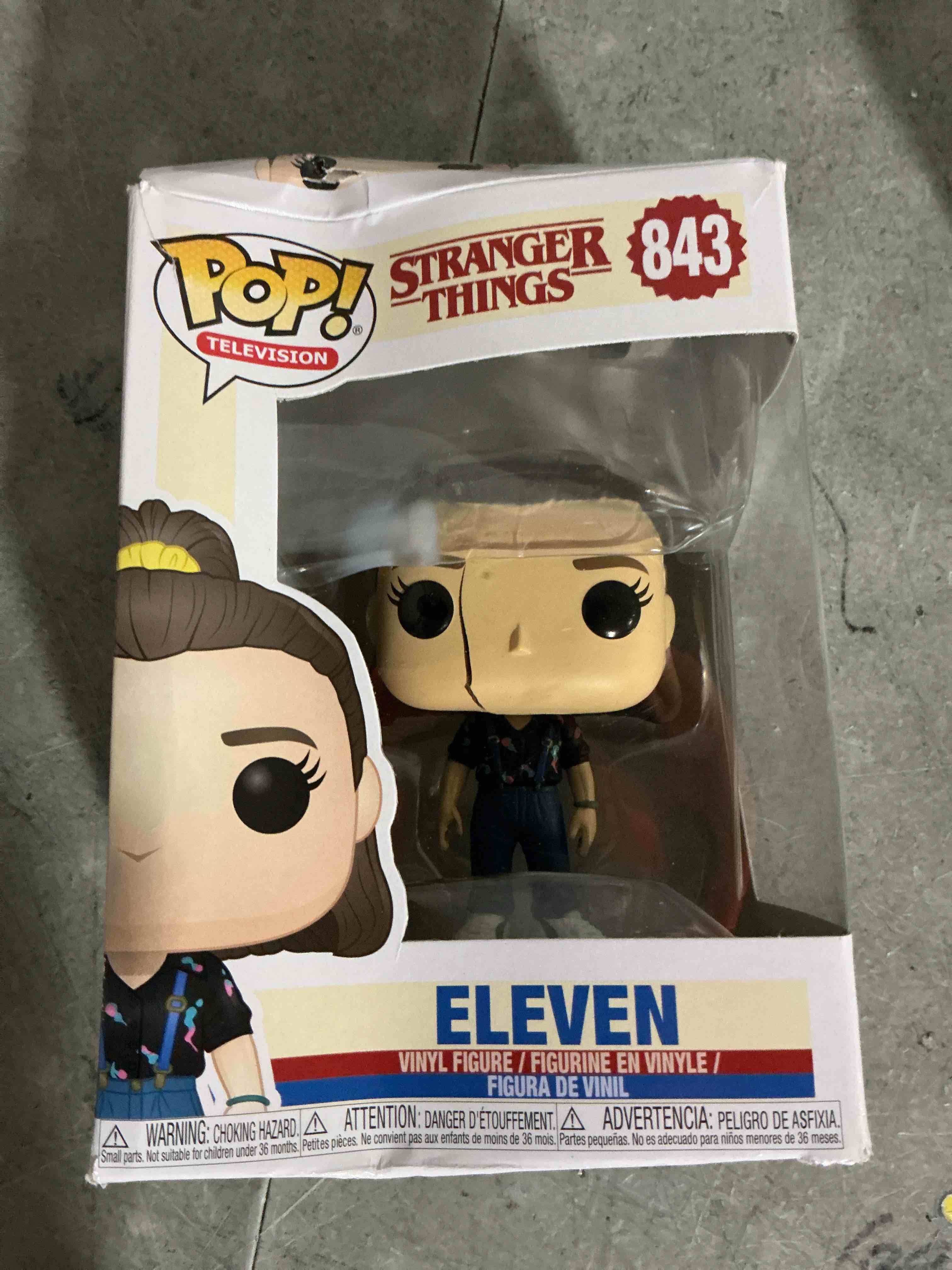 Condition photo showing As Is for (broken)pop stranger things - eleven with suspenders funko vinyl figure (bundled with compatible pop box protector case), multicolor, 3.75 inches