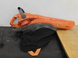 Husqvarna BV 1200 electric leaf blower and vacuum with an attached black collection bag.