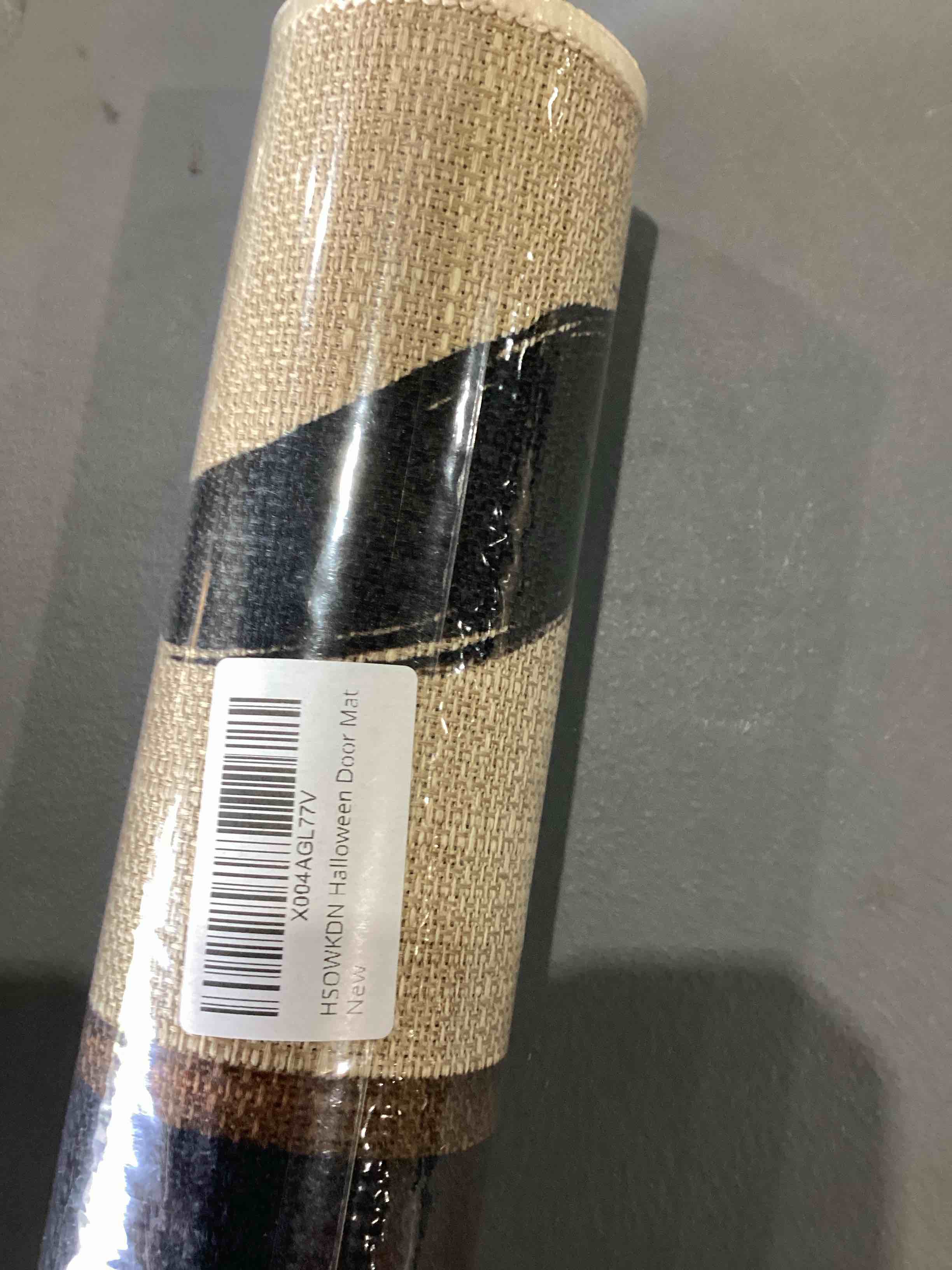 Condition photo showing New/Like New for halloween mat