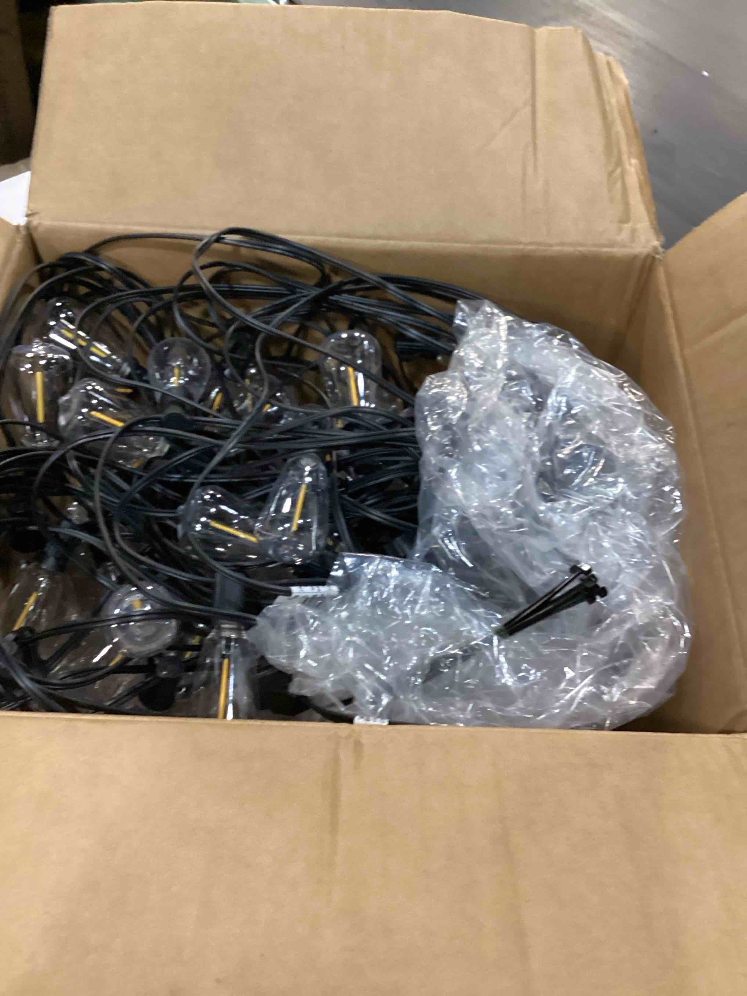Condition photo showing Good Condition for brightever outdoor string lights 200ft waterproof, patio string lights for outside with 100+4 st38 shatterproof led filament bulbs, dimmable hanging lights for christmas, party, cafe (2-pack 100ft) black wire 200ft-warm white