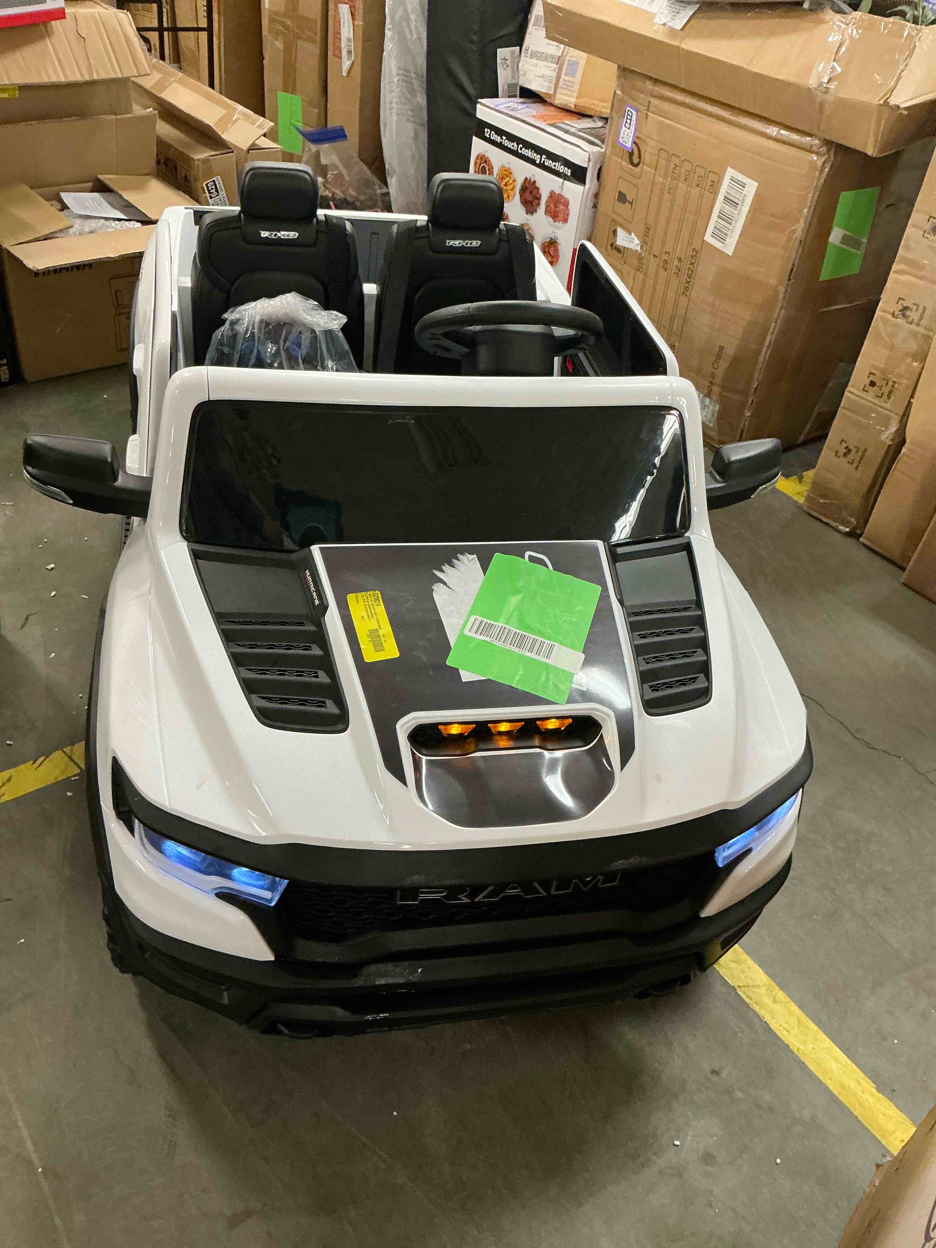 Condition photo showing Good Condition for iYofe Ram 24V Ride on Car 2 Seater, Ram 1500 RHO Battery Powered Electric Car Truck with 4 Wheels, Ride on Toy with Remote Control for Big Kids Toddlers 3-8 Boys Girls, Bluetooth & Trunk, White