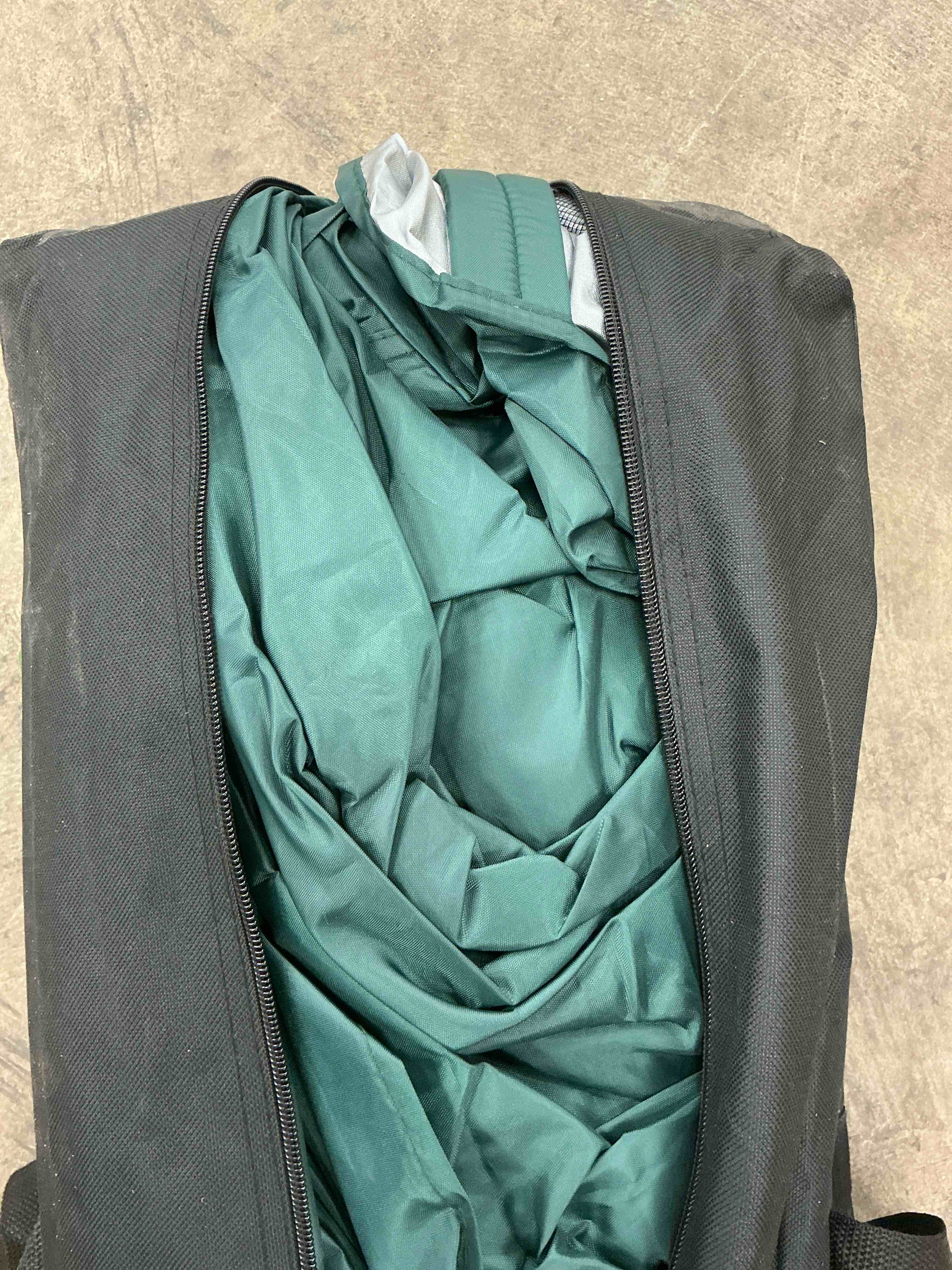 Condition photo showing Good Condition for gvdv 10x10 pop up canopy tent with wheeled bag 4 stakes 4 ropes 100sqft of shade forest green