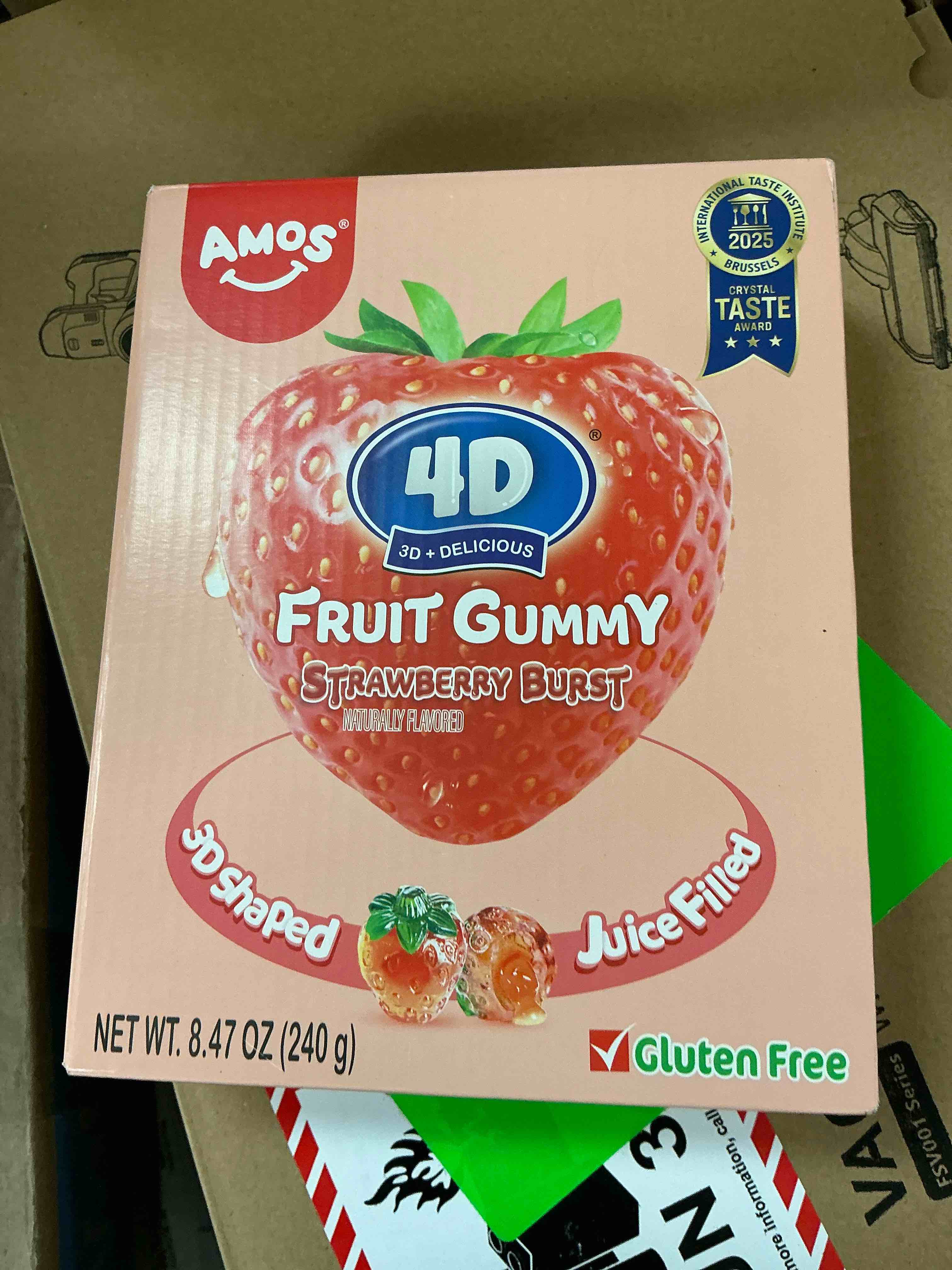 Condition photo showing New/Like New for (best by 10-11-2026) amos 4d gummy strawberry burst no-fat natural flavored fruit snacks sharing size 8.47oz