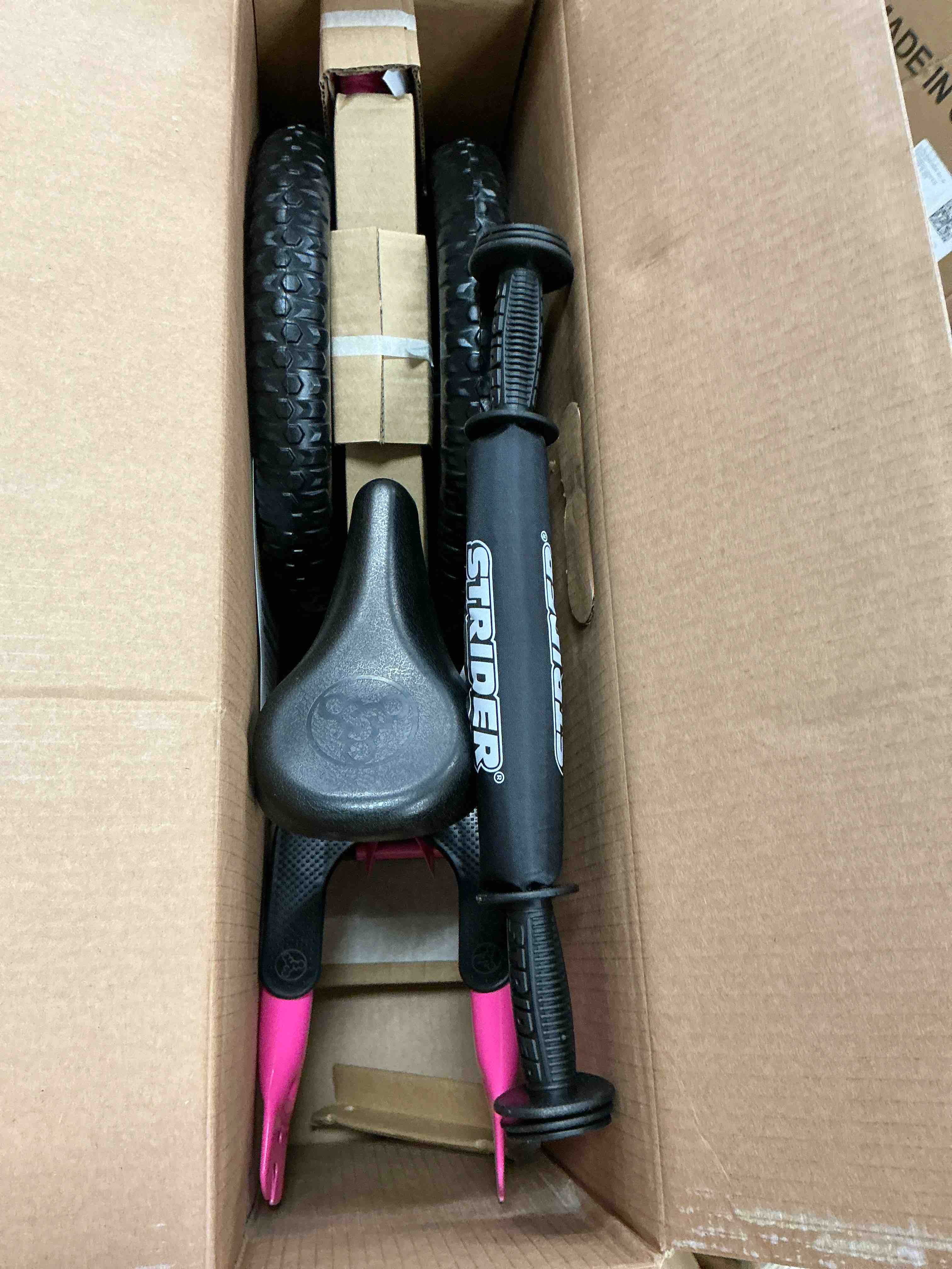 Condition photo showing New/Like New for strider 12” sport bike pink - no pedal balance bicycle for kids 1 to 4 years - includes safety pad padded seat mini grips & flat-free tires - tool-free assembly & adjustments