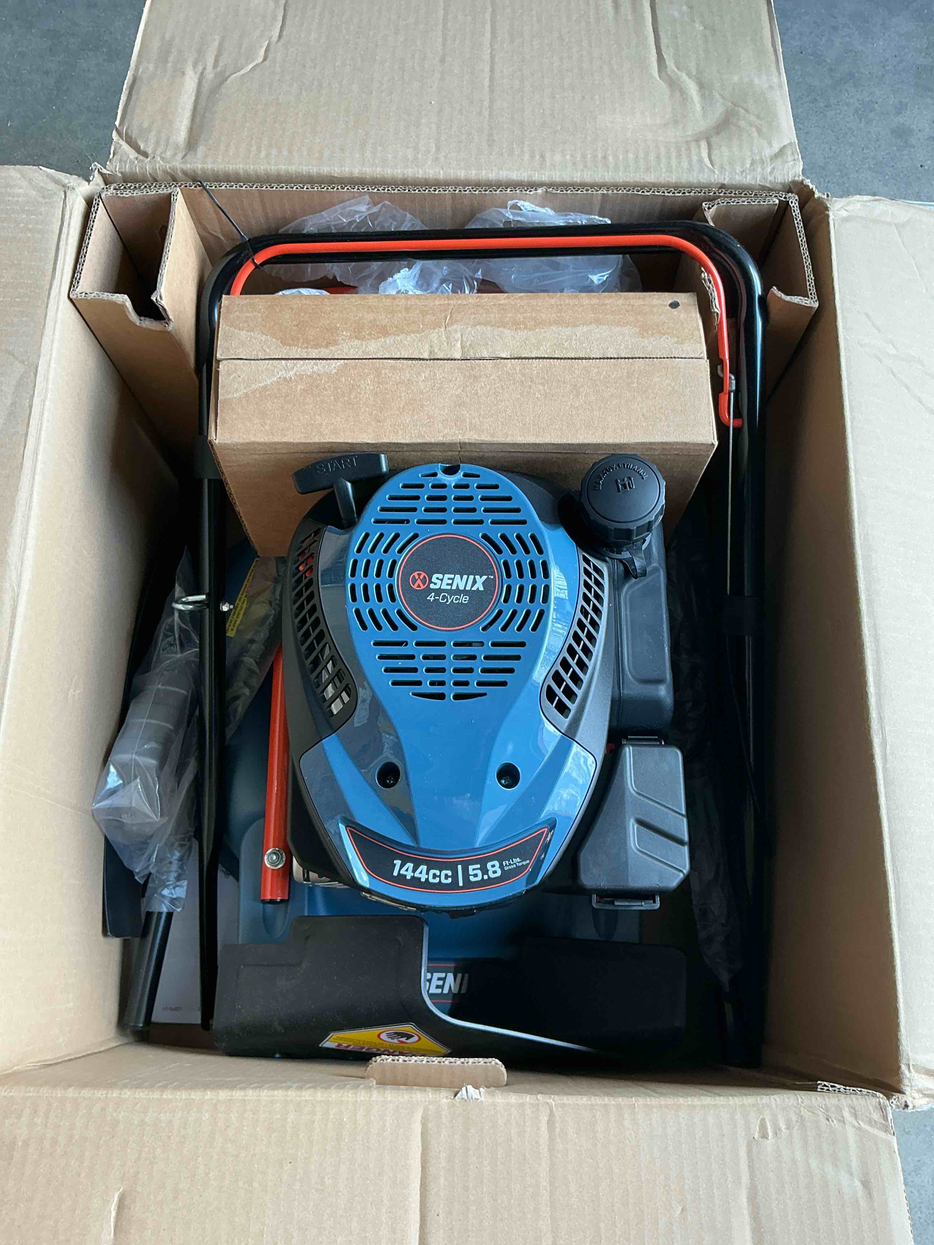 Condition photo showing New/Like New for senix gas lawn mower 18in cutting blade / 19in cutting deck 144cc 4-cycle engine push mower with side discharge