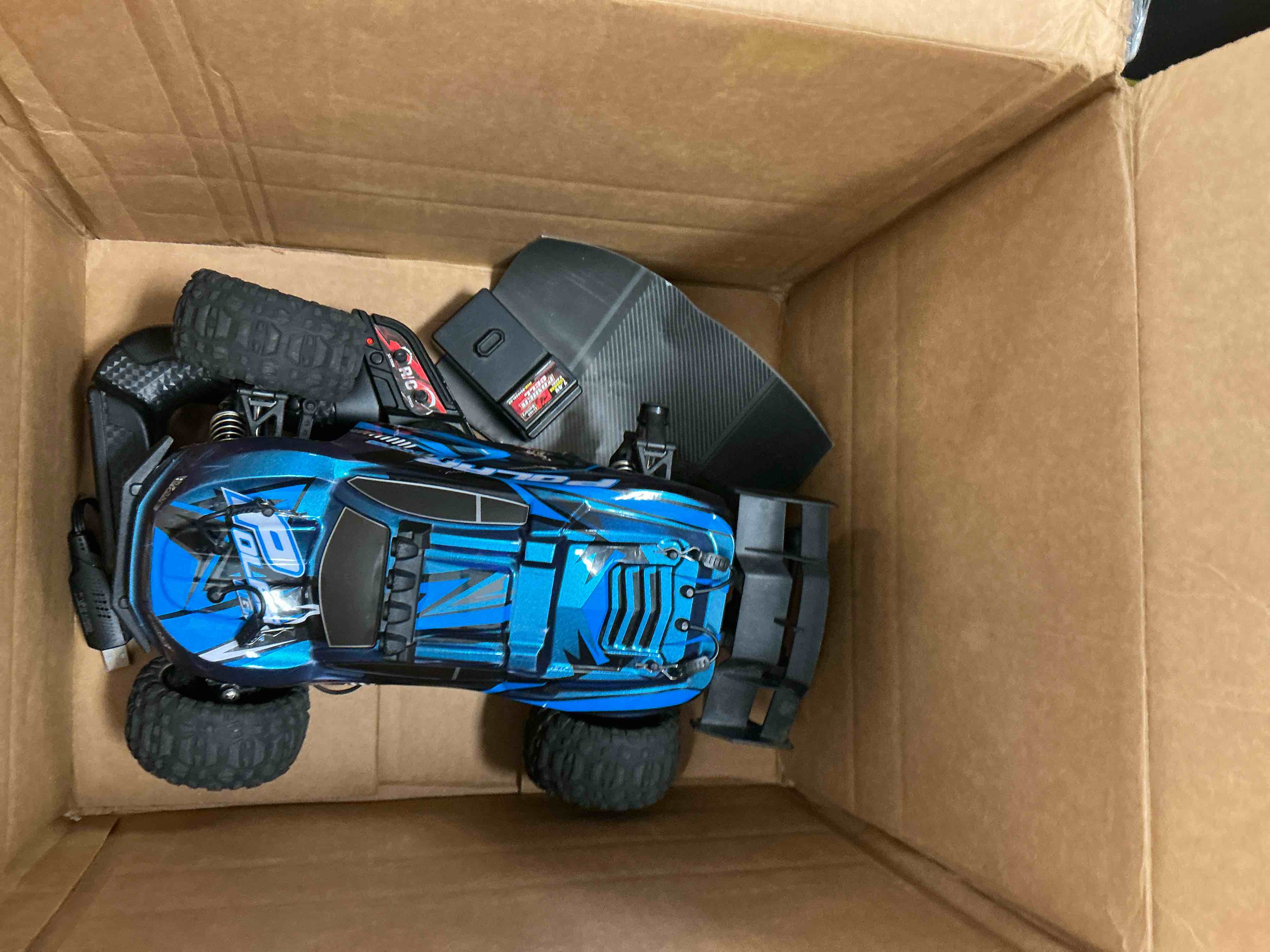 Condition photo showing As Is for FAGINEY RC Cars for Adults Fast 40+MPH 1:14 Waterproof Off-Road RC Truck 4WD All Terrain High-Speed Remote Control Car Toy Gifts for Kids Boys, 2 Batteries