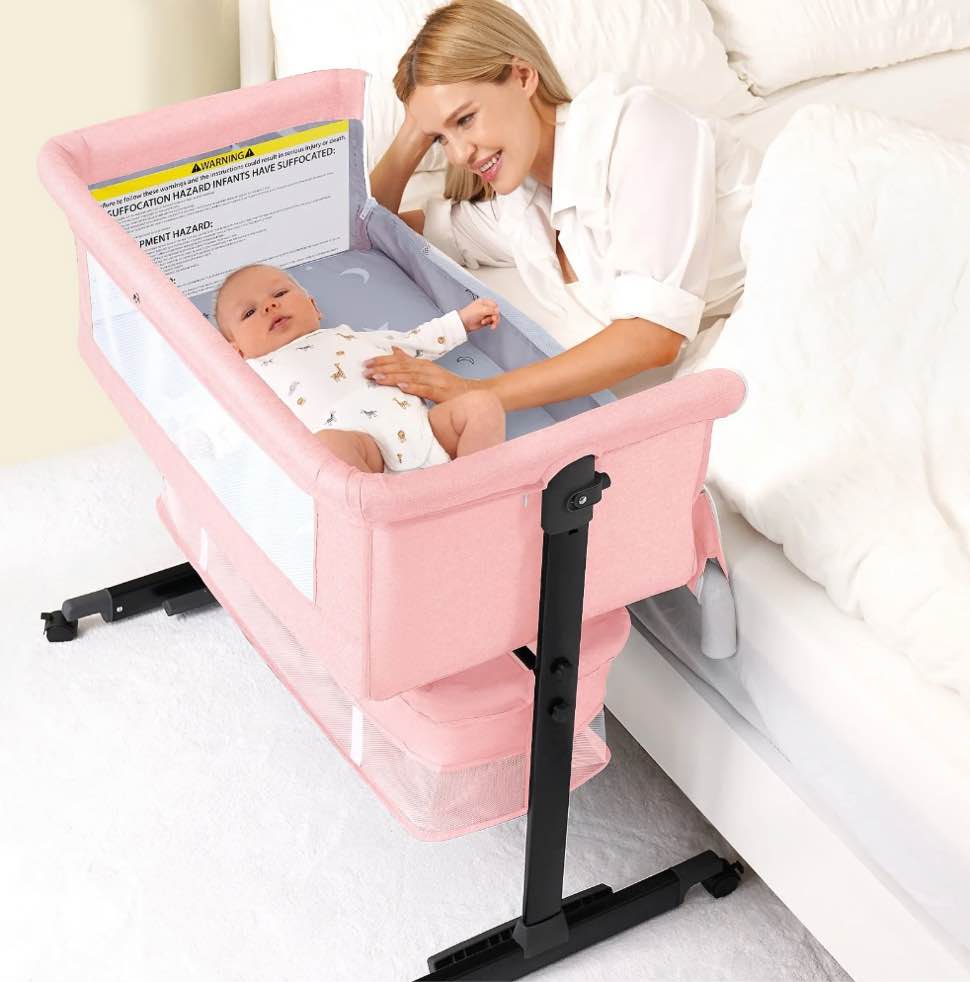 kmaier Baby Bassinet Bedside Crib Foldable Portable with Adjustable Height, Wheels, and Storage Basket?Pink