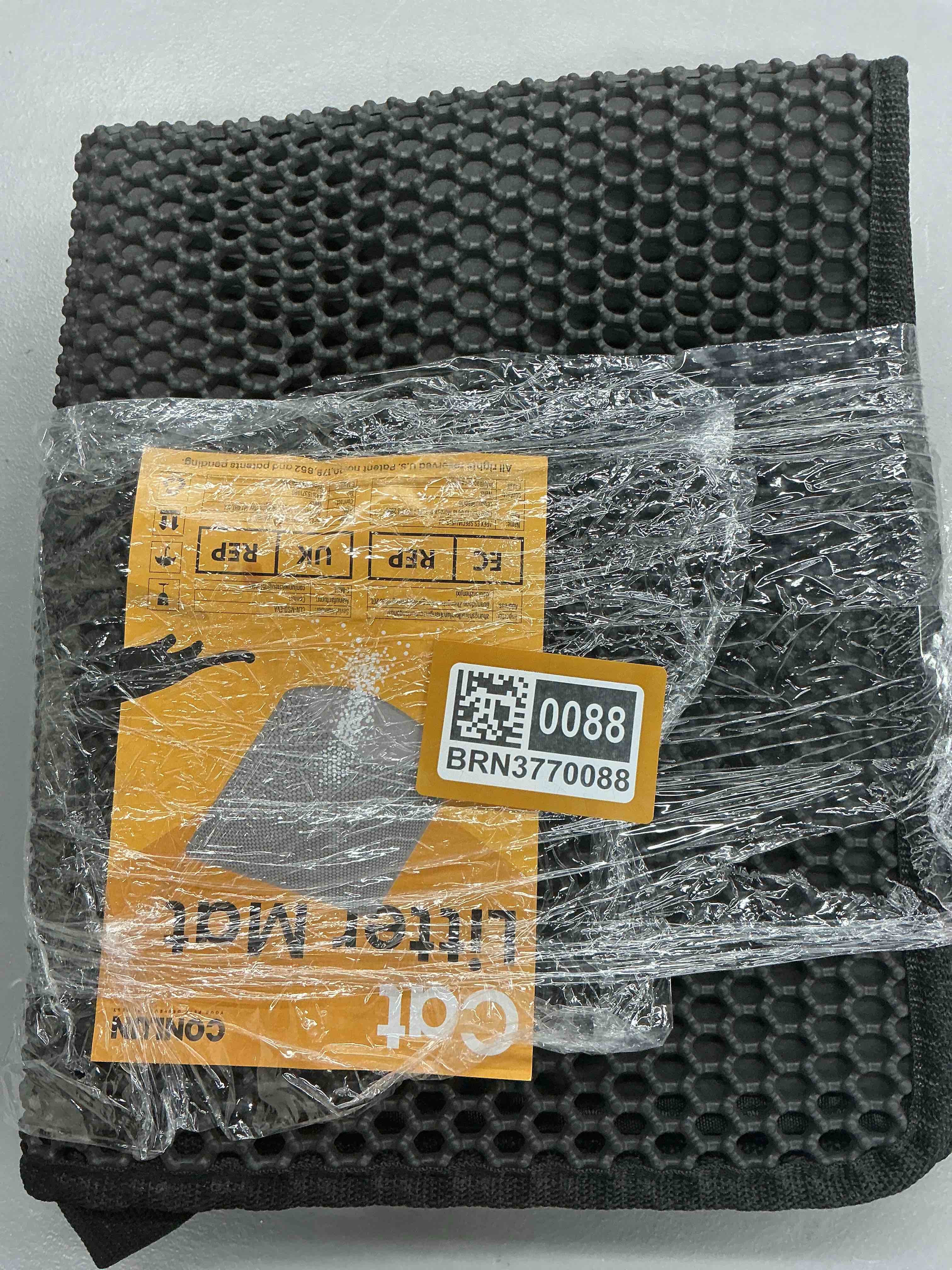 Condition photo showing New/Like New for cat litter mat-30"x24" large litter boxtrapping mat for kitty eva honeycomb double layer design, urine & waterproof with handle design easier to clean, washable, black black 30” x 24”